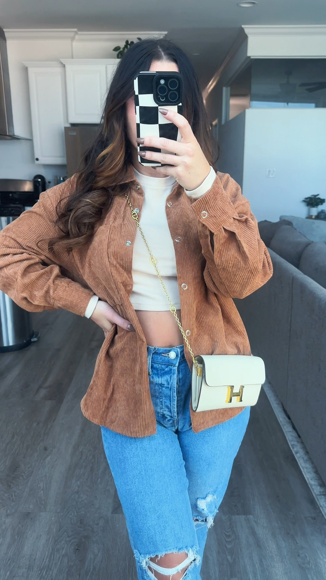 Fall outfit with cream long sleeved cropped shirt, corduroy button up jacket, jeans, and DHgate bag

#LTKstyletip #LTKitbag #LTKSeasonal