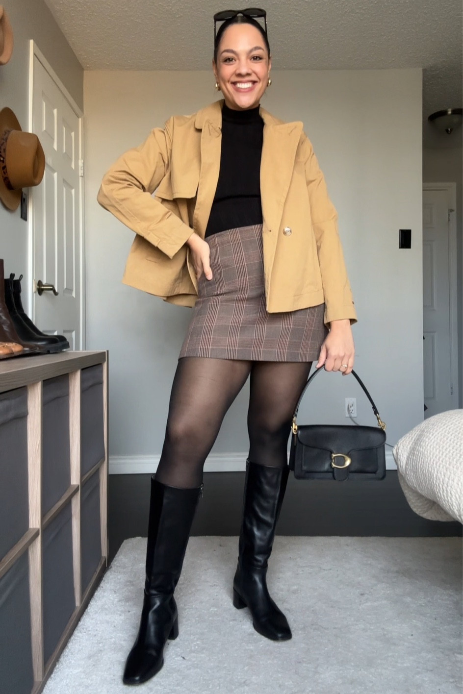 Winter outfit inspiration! Details below:
-Abercrombie black long sleeve turtleneck top, I have a medium. 
-Plaid mini skirt from aritzia, similar linked. 
-Madewell cropped tan trench coat, I have a size 8  
-Black tights from H&M. 
-Coach tabby shoulder bag. 
-Black knee high leather boots. 
-Celine Triomphe sunglasses. 

#LTKstyletip #LTKSeasonal #LTKfindsunder100