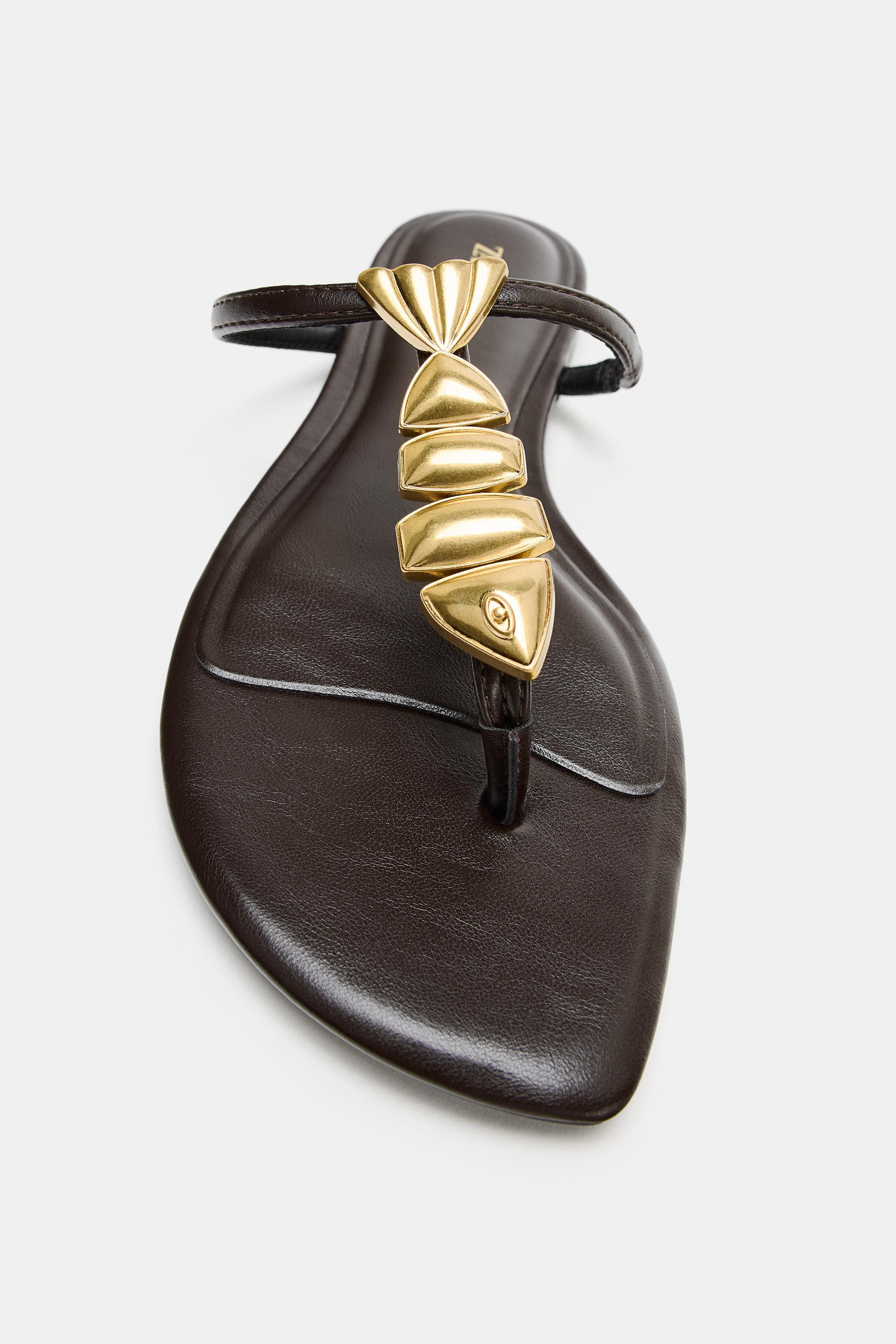 Flat sandals with metallic fish-shaped appliqu\u00e9 detail. Front strap with toe post. Irregular... | Zara US