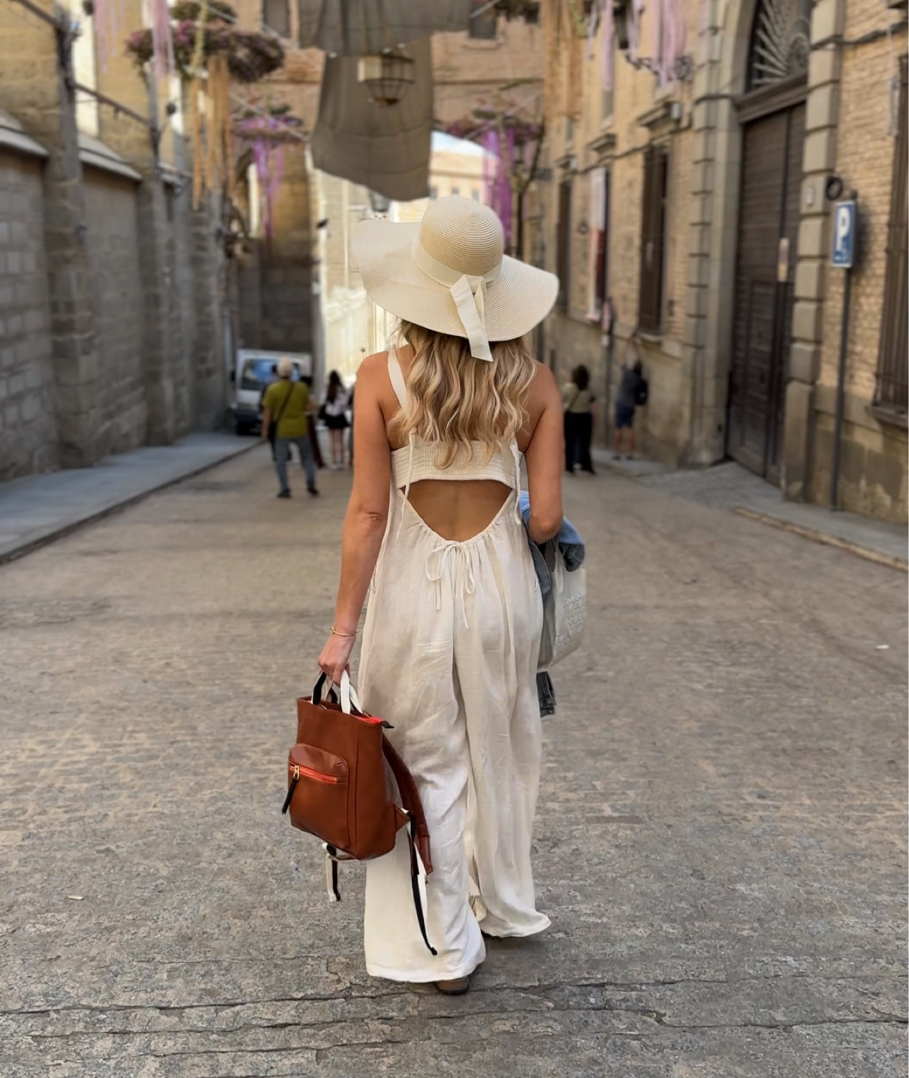 The perfect summer jumpsuit. It’s super comfy and gives all the summer vibes. You can wear a strapless underneath as well! I am wearing an XS. 

Mini backpack, oversized jean jacket, summer hat, beach hat, Birkenstock sandals, summer sandals 

#LTKTravel #LTKFindsUnder100 #LTKFindsUnder50