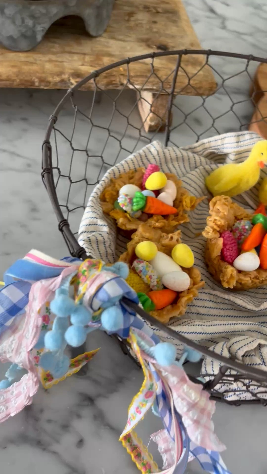 Edibile Easter Baskets! 🐣 

- 1/2 cup butter 
- 1 bag mini marshmallows 
- 1/2 cup Karos syrup 
- 1 cup sugar 
- 1.5 cup peanut butter 
- 6 cups corn flakes cereal 

Over medium heat, melt butter in a large sauce pan. Add sugar and corn syrup. Being to a boil for 3 minutes. Add peanut butter.  Stir.  Remove from heat gently store in cereal. Form nests in a greased cup cake pan. Let cool.  Remove from pan and fill with your favorite Easter candy! 