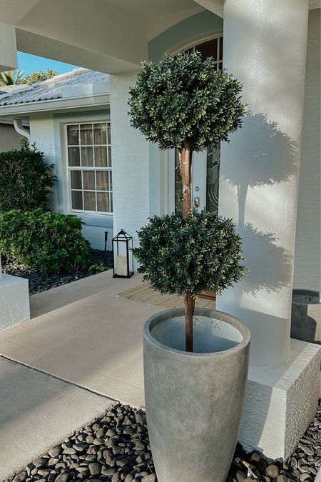 Faux concrete planters and faux boxwood trees and bushes 

#LTKSeasonal #LTKhome #LTKfamily