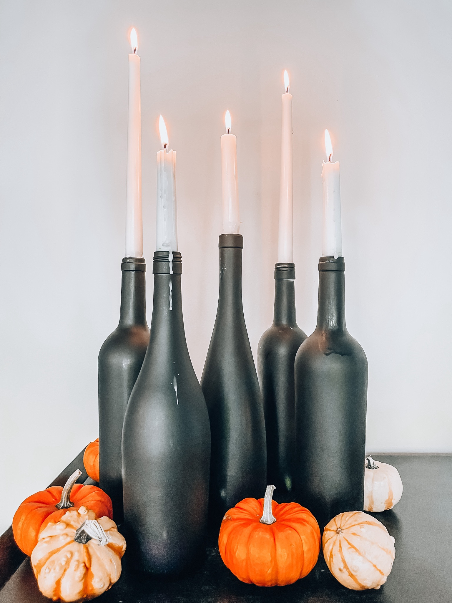 DIY Halloween craft. Order these wine bottles or save your own to spray paint and add candles. Makes a great centerpiece addition to your Halloween party  

#LTKparties #LTKSeasonal #LTKhome