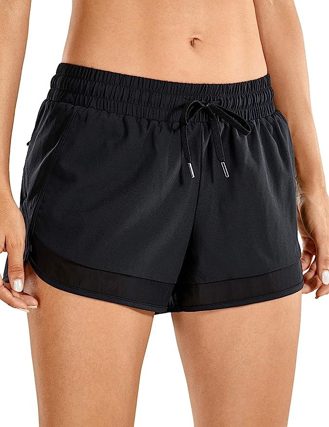 CRZ YOGA Women's Quick Dry Workout Running Shorts Loose Drawstring Athletic Gym Shorts with Zip P... | Amazon (US)