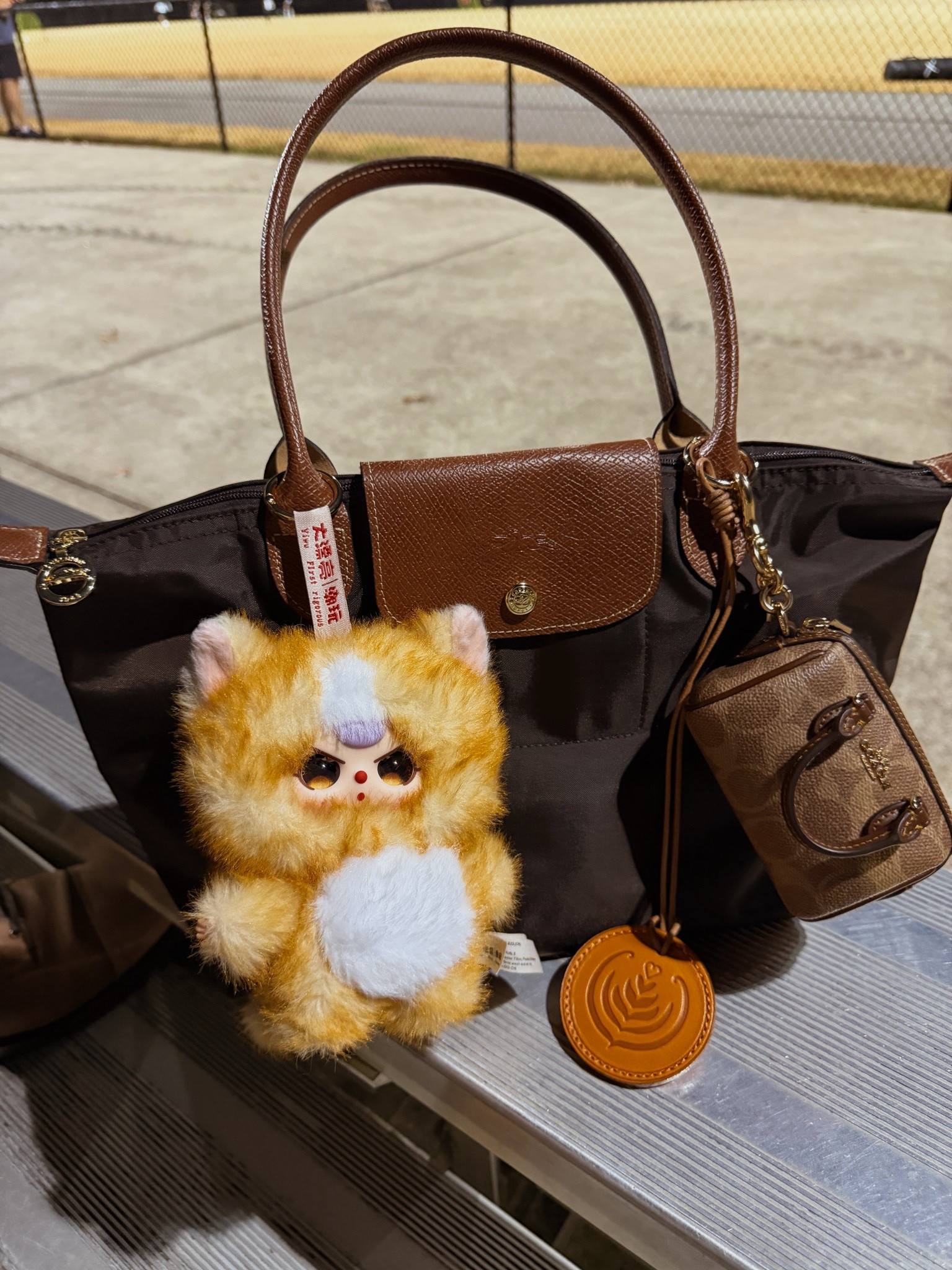 Longchamp look for less nylon tote 🤎
 Coach Rowan mini coin purse bag charm
Latte leather bag charm
Baby three blind box bag charm 🤎

#LTKGiftGuide #LTKootd #LTKdayinmylife