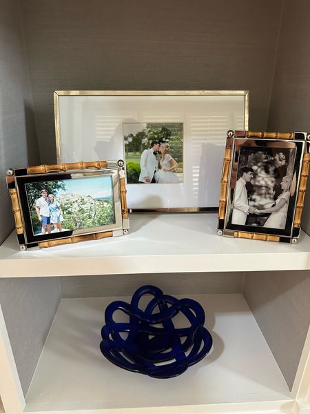 A new addition to my bookshelves are these bamboo picture frames! I love them because they make the space more elevated and like that I can mix them in with different metals and textures. They also are a great neutral and went for the splurge since I like to rearrange in my home often they would look good in other spots! 🩷 picture frames, home decor, William toward, bamboo decor, luxury home pieces, interiors, bookshelf styling, LTK home 

#LTKHome