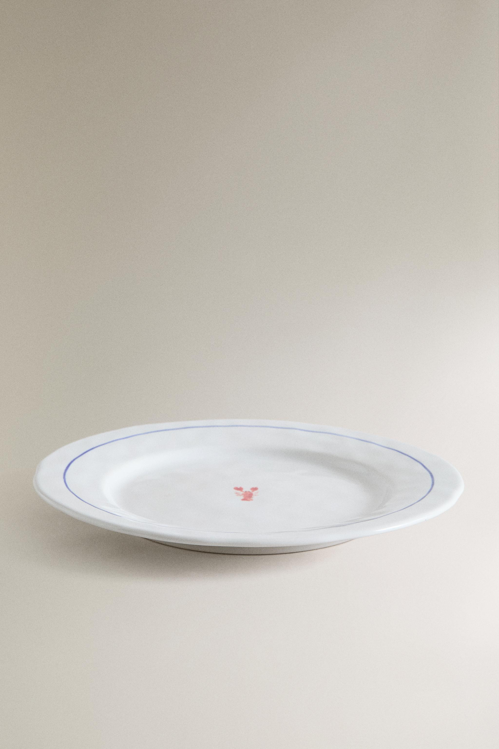 Stoneware dinner plate with a scalloped blue edge. Featuring a decorative lobster motif in the ce... | Zara UK