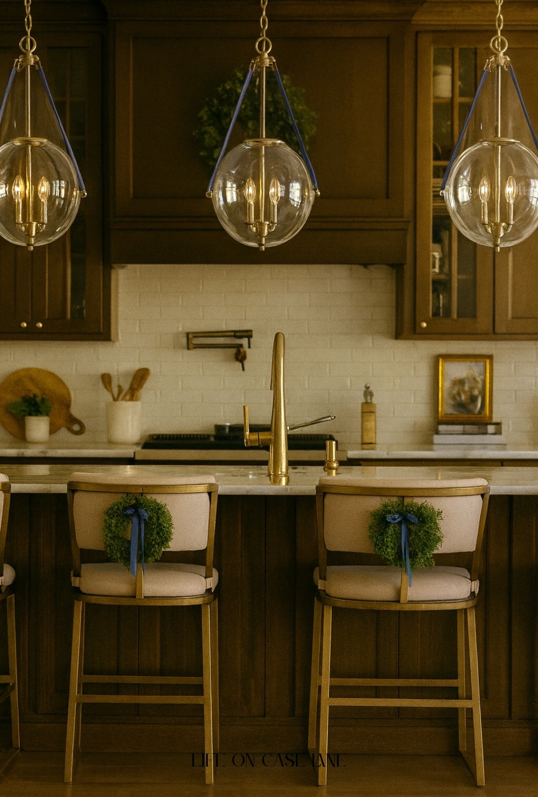 Wood toned kitchen - kitchen pendant lights, counter stools, kitchen island, kitchen sink, kitchen sink faucet, pot filler, backsplash, kitchen decor 

#LTKHome #LTKSeasonal