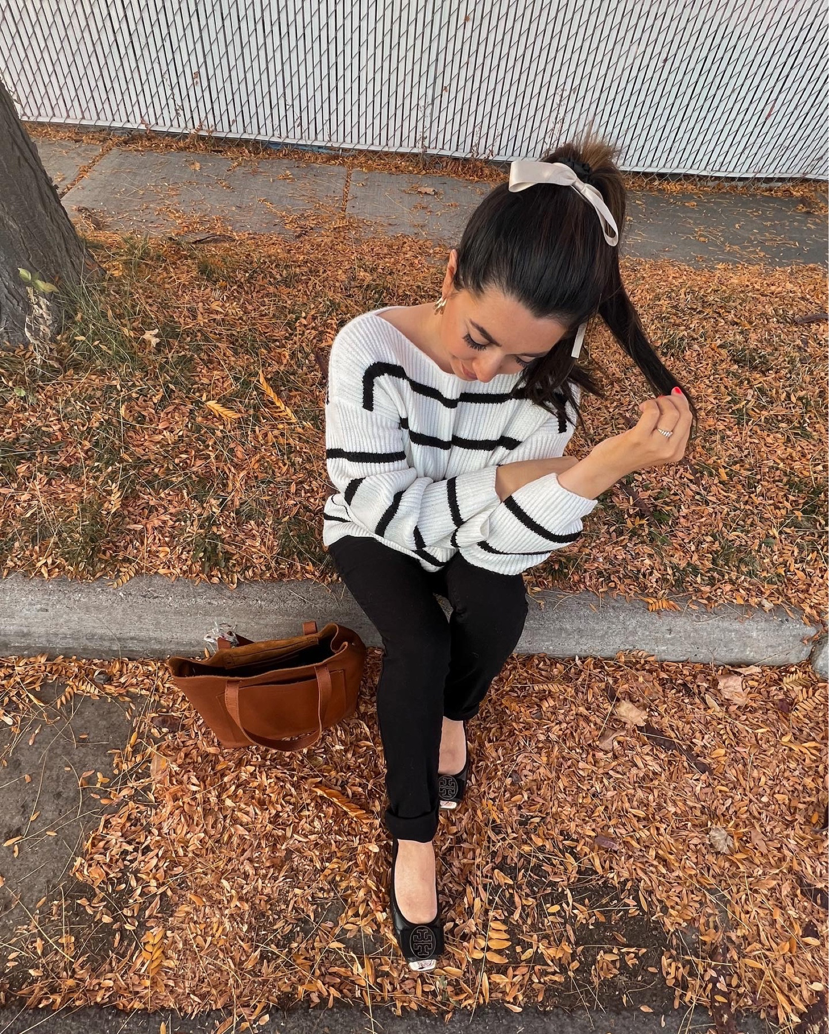 It's autumn and I'm feeling inspired! So, I thought I'd share some fall outfit inspiration with you all. I'm wearing this cozy white and black striped sweater paired with some classic black skinny jeans. To keep things comfortable, I'm rocking my favorite Tory Burch flats. My hair is up in a cute ponytail with a cream bow to add a touch of femininity to the look. And to finish it off, I'm wearing some vintage gold jewelry to add some sophistication.

#LTKfindsunder100 #LTKHoliday #LTKSeasonal