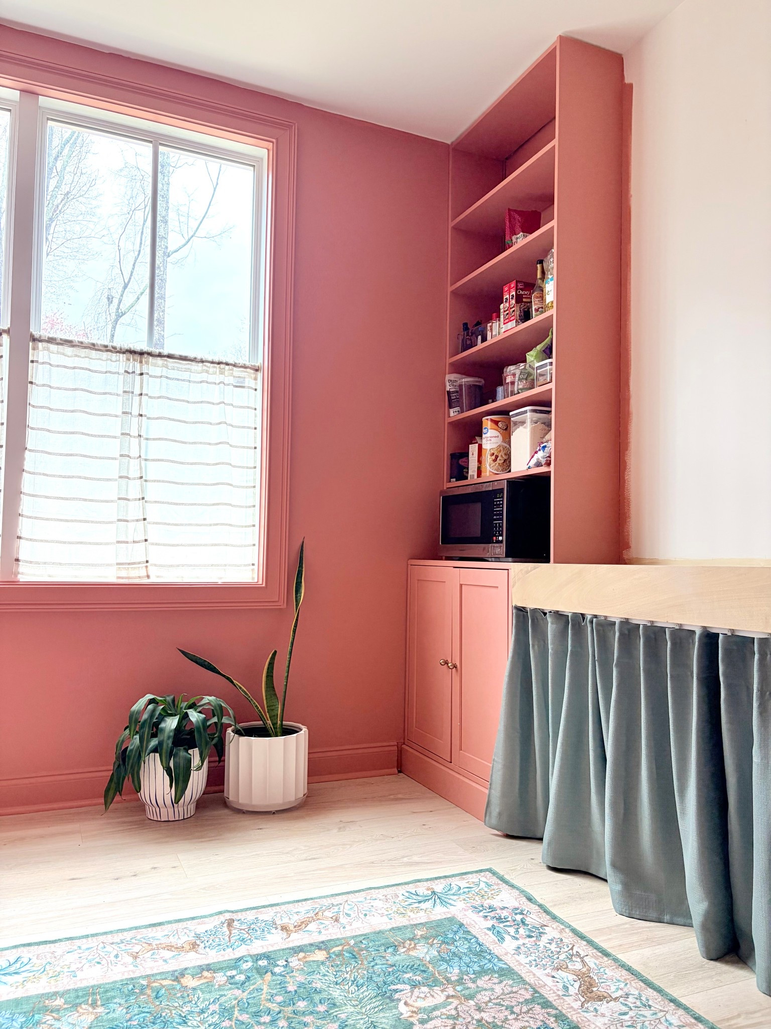 Sharing the first glimpse into our work-in-progress pantry! {Enjoy the walk through video on my Instagram story!} We built out the cabinets from IKEA and painted them Sherwin Williams Constant Coral. With new paint and upgraded hardware it gives the cabinets a custom look without the custom price tag. Next on the list: finish pant, trim, tile on that white wall, add a shelf and accessorize 👏🏼 


#pantry #cabinetry #coral #paint #scullery 

#LTKHome