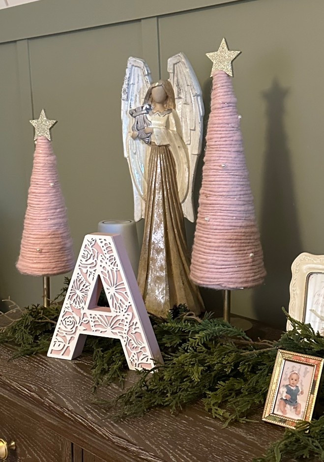 I got these really cute pink wool Christmas trees to add to my daughters room. I really wanted some Christmas decor that went with the theme in her room and I absolutely love them! Then I added garland that I already had and an angel to finish the decoration 

#LTKSeasonal #LTKHoliday #LTKKids