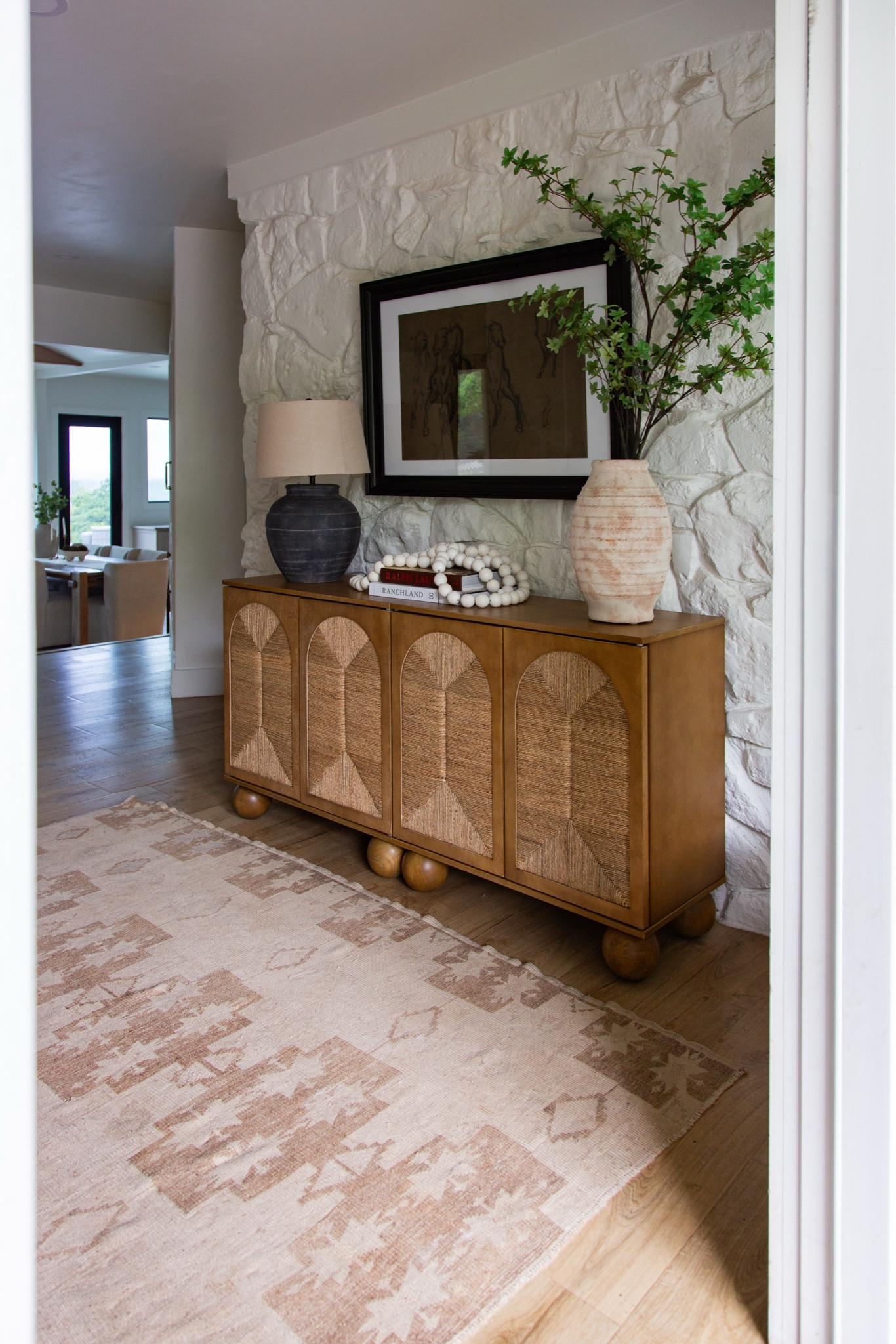 This little entry moment might be one of my favorites in our home right now. The Leah cabinet from Nathan James brings in so much warmth with the woven seagrass detail against the stone wall… it’s that perfect mix of texture on texture that makes a space feel layered and lived in. Such a good piece if you want something functional but still design-forward.

Keywords: entryway decor ideas, stone wall styling, woven cabinet, seagrass furniture, neutral home decor, organic modern style, console table styling, textured furniture, warm wood tones, earthy interiors, entryway storage, home styling inspiration @Nathan James 

#LTKSeasonal #LTKHome #LTKdayinmylife