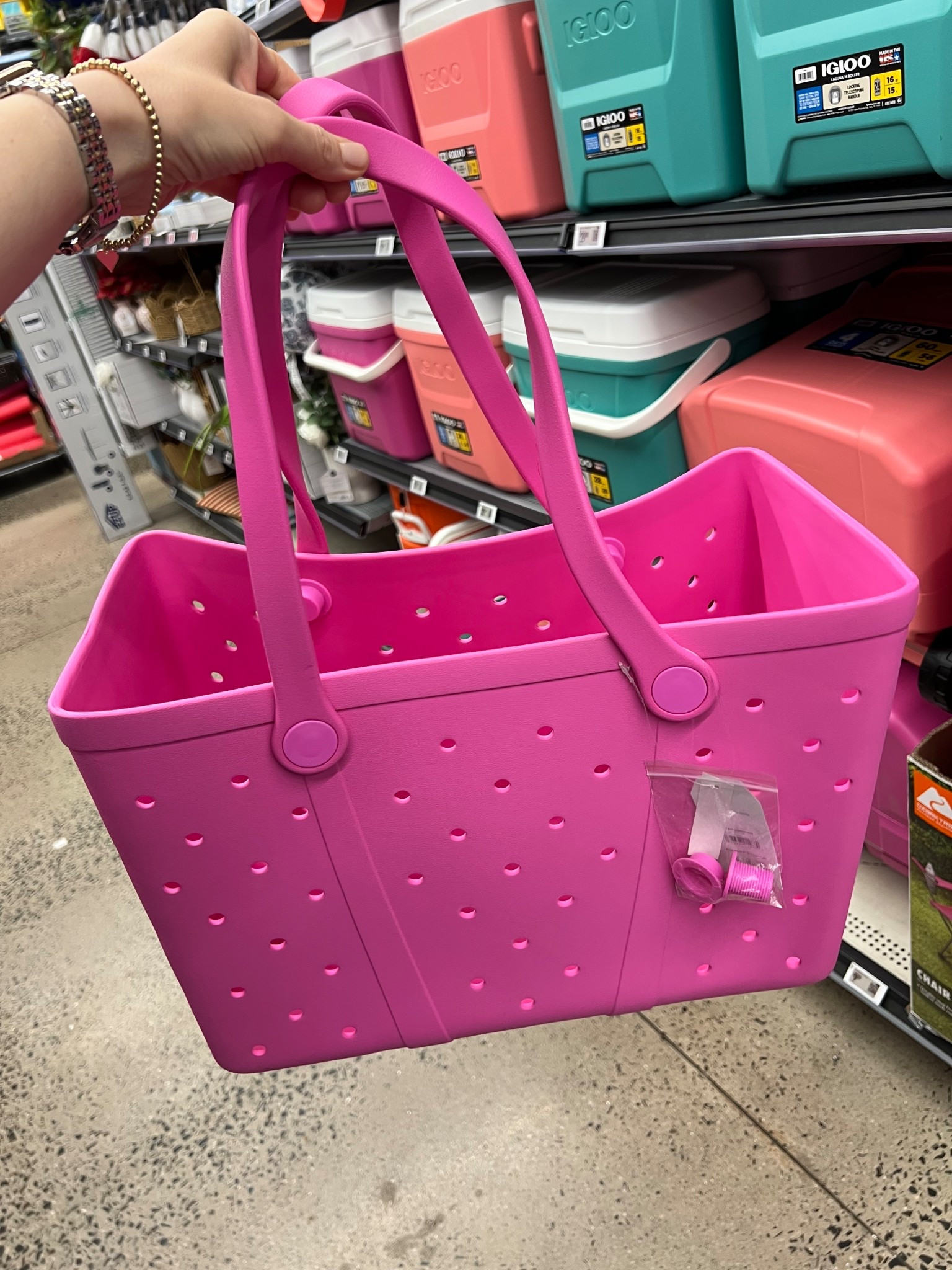 Bogg bag look for less at Walmart! I enjoyed mine last summer - one of the strap caps came off and looks like this was a common problem because this years bags come with two spares! 😆👏