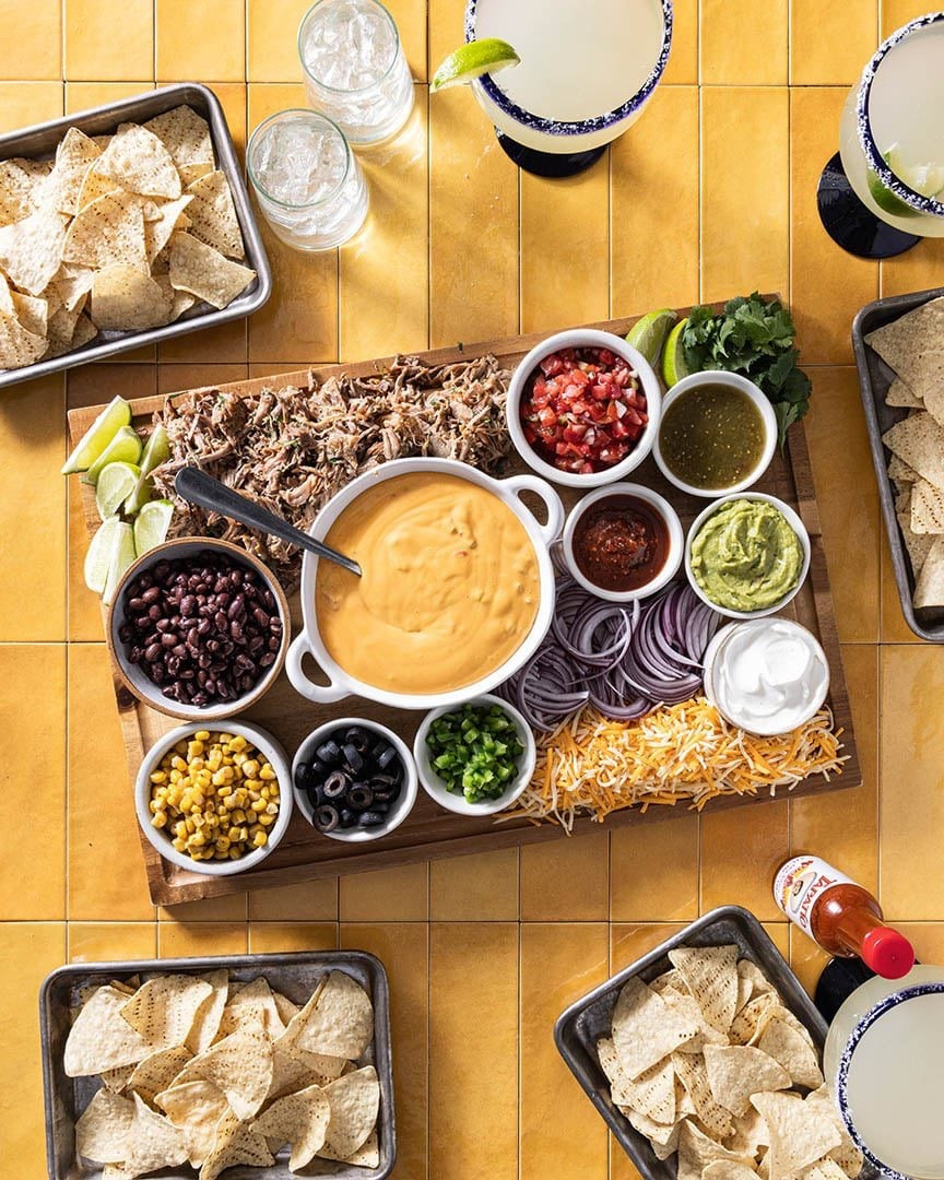 This nacho toppings bar really ups the party snack ante! I know it’s hard to imagine that nachos can get much better than they already are, but what if I told you that everyone could customize their own plate of nachos based on what they think are the best toppings?

#LTKfoodie #LTKSeasonal