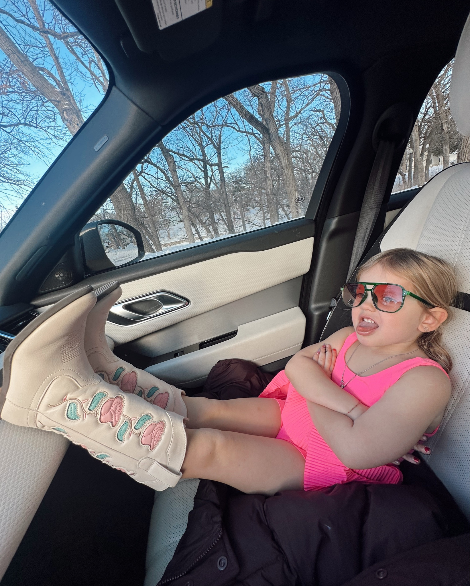 Ellie’s cowgirl boots she can’t get enough of. Rocking mom’s sunglasses & acting like it’s 90 degrees when it’s -5! 