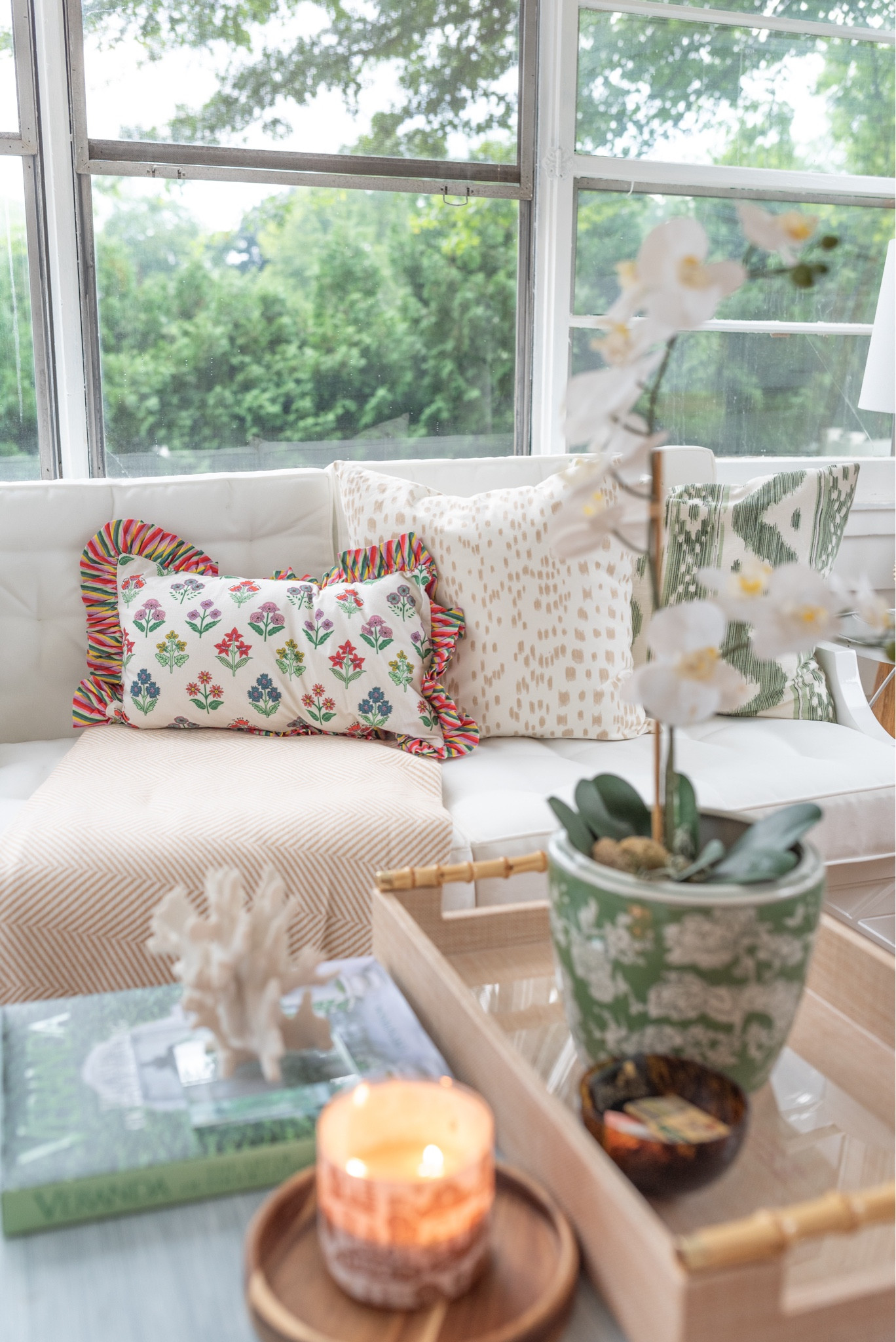 A pop of color in the sunroom. Pillows & decor linked for you 

#LTKOver40 #LTKFindsUnder100 #LTKHome