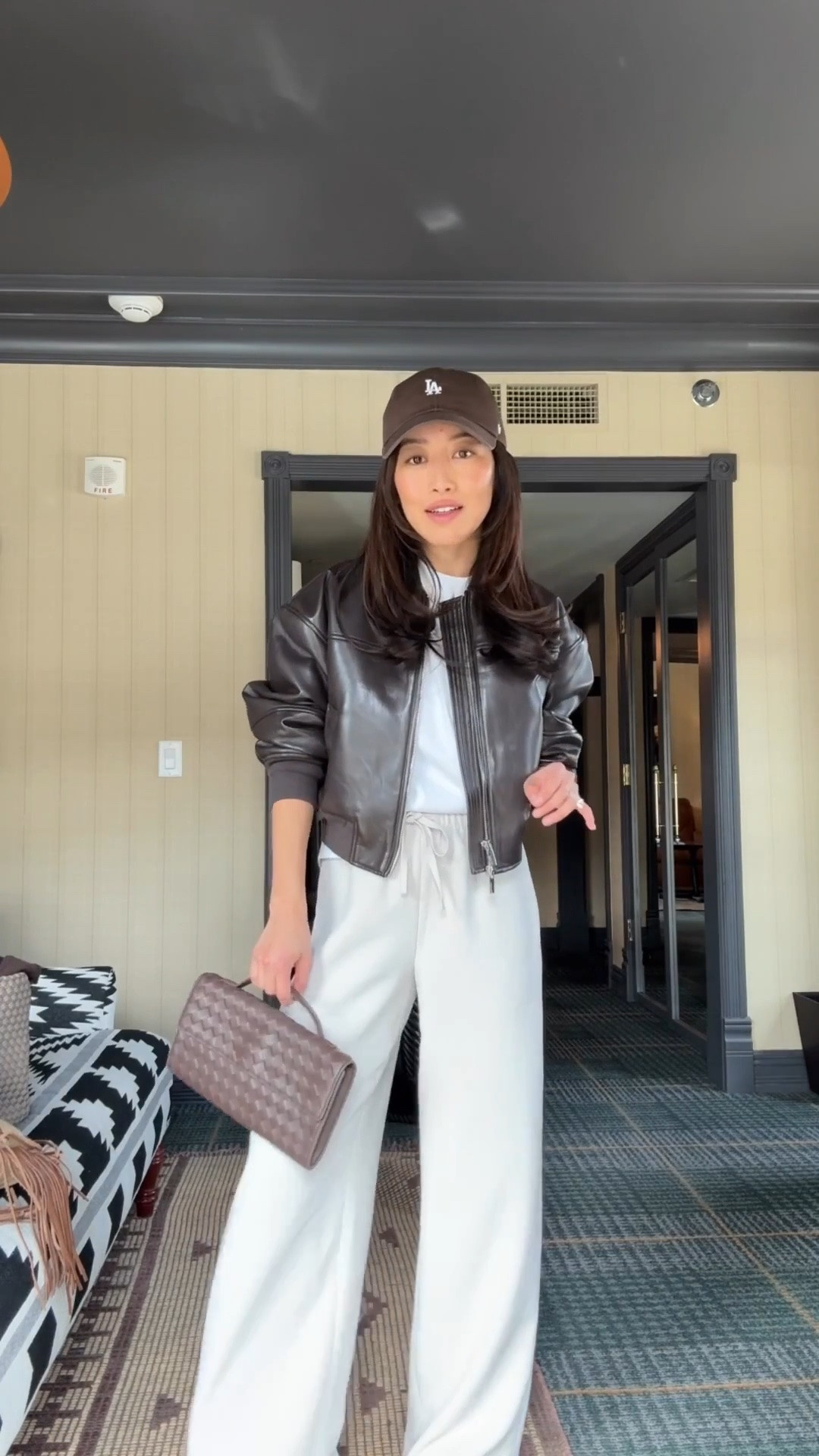 Sizing info below and linked a similar jacket for less 
• Lodge pants 2XS short - runs long for petite. If you’re very short you are better off getting any length and hemming them. pull on elastic waist, wrinkle resistant, and beautiful drape. 
• Aritzia faux leather jacket 2XS got this over a year ago with no issues. this is a more structured, edgier cut jacket that I always feel chic in and love for school drop off, running errands 
• Madewell boxy oversized tee xxs bigger fit shorter length 
• Sam Edelman slingback kitten heels 5.5 size up if between sizes since toe can be a little narrow 
• Quince handwoven top handle clutch 
• 47 brand hat

#LTKTravel #LTKPetite #LTKootd