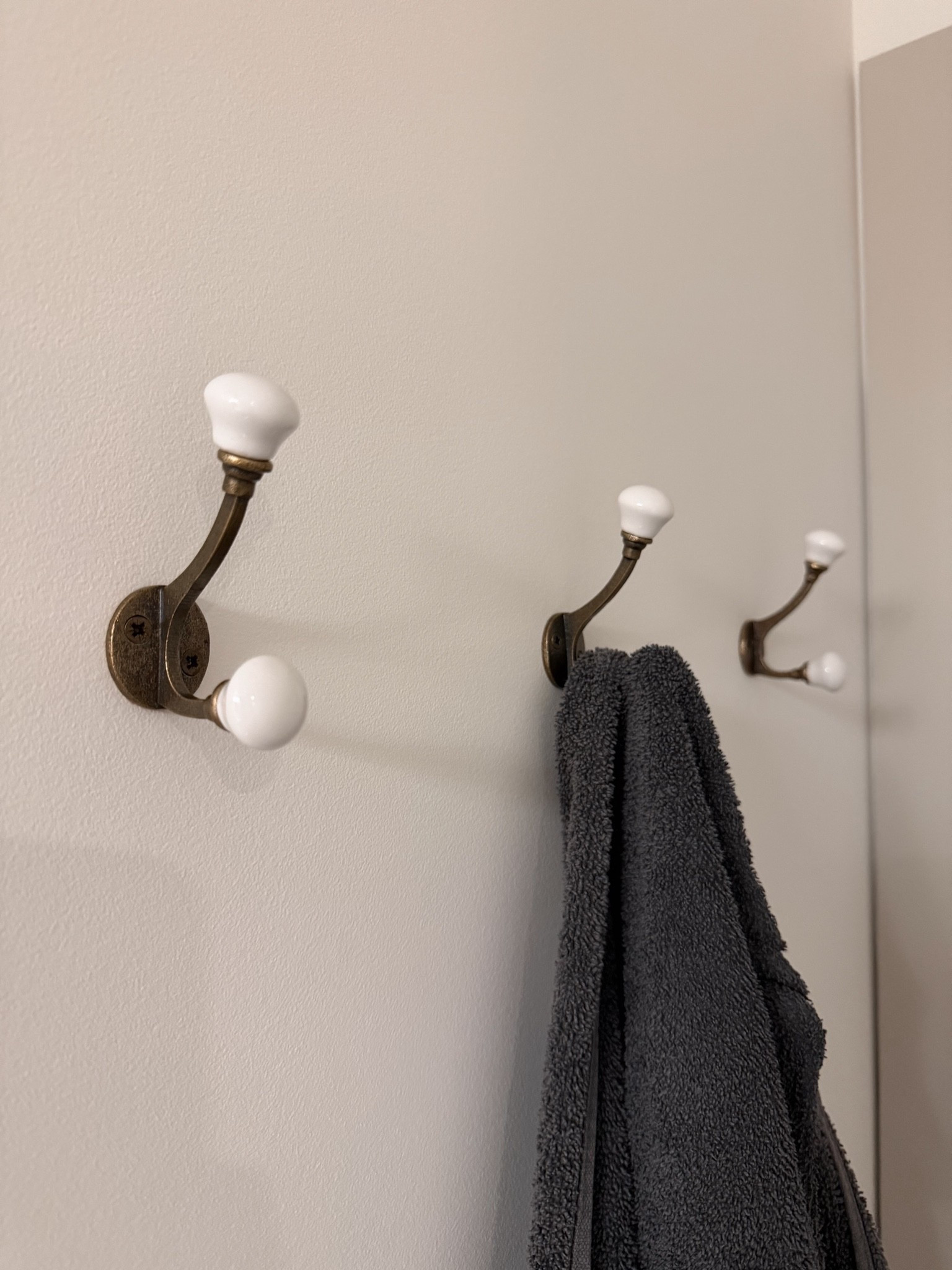 Proof that sometimes the best home upgrades cost less than takeout. 😂 After living in our house for 10 years, I finally added hooks to our bathroom, and I can't believe I waited this long. These ceramic hooks are only $13, but they add so much function while fitting perfectly with a modern organic style. The shape feels elevated, the finish looks high-end, and they're perfect for hanging towels, robes, or even a basket. It's one of those small details that makes a room feel more intentional and pulled together without spending a fortune. Linked here.

#LTKhome #LTKstyletip