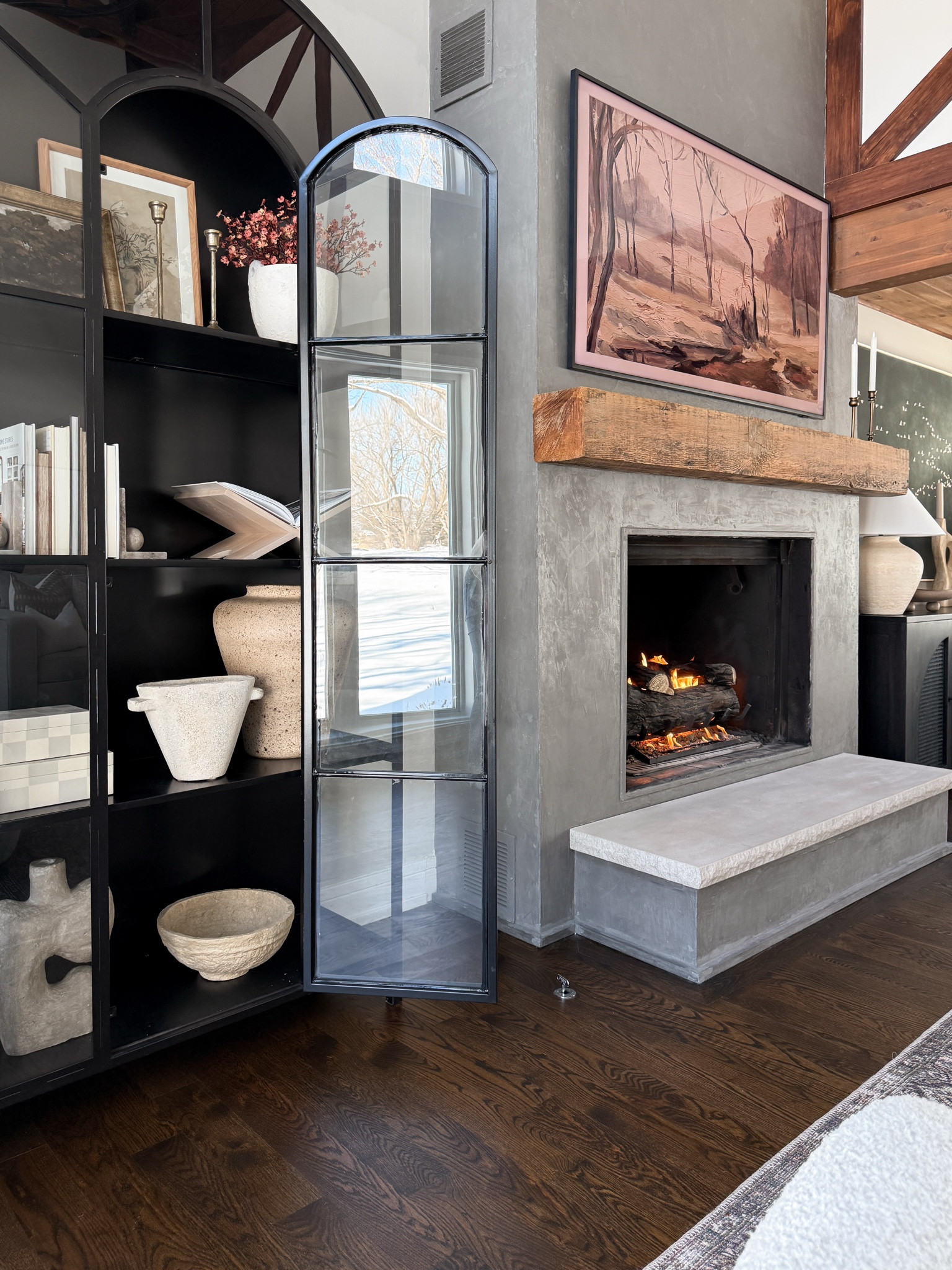 Cabinet styling 🤍 I love this large arch display cabinet and finally refreshed the shelf styling! 

#LTKStyleTip #LTKHome #LTKFindsUnder100