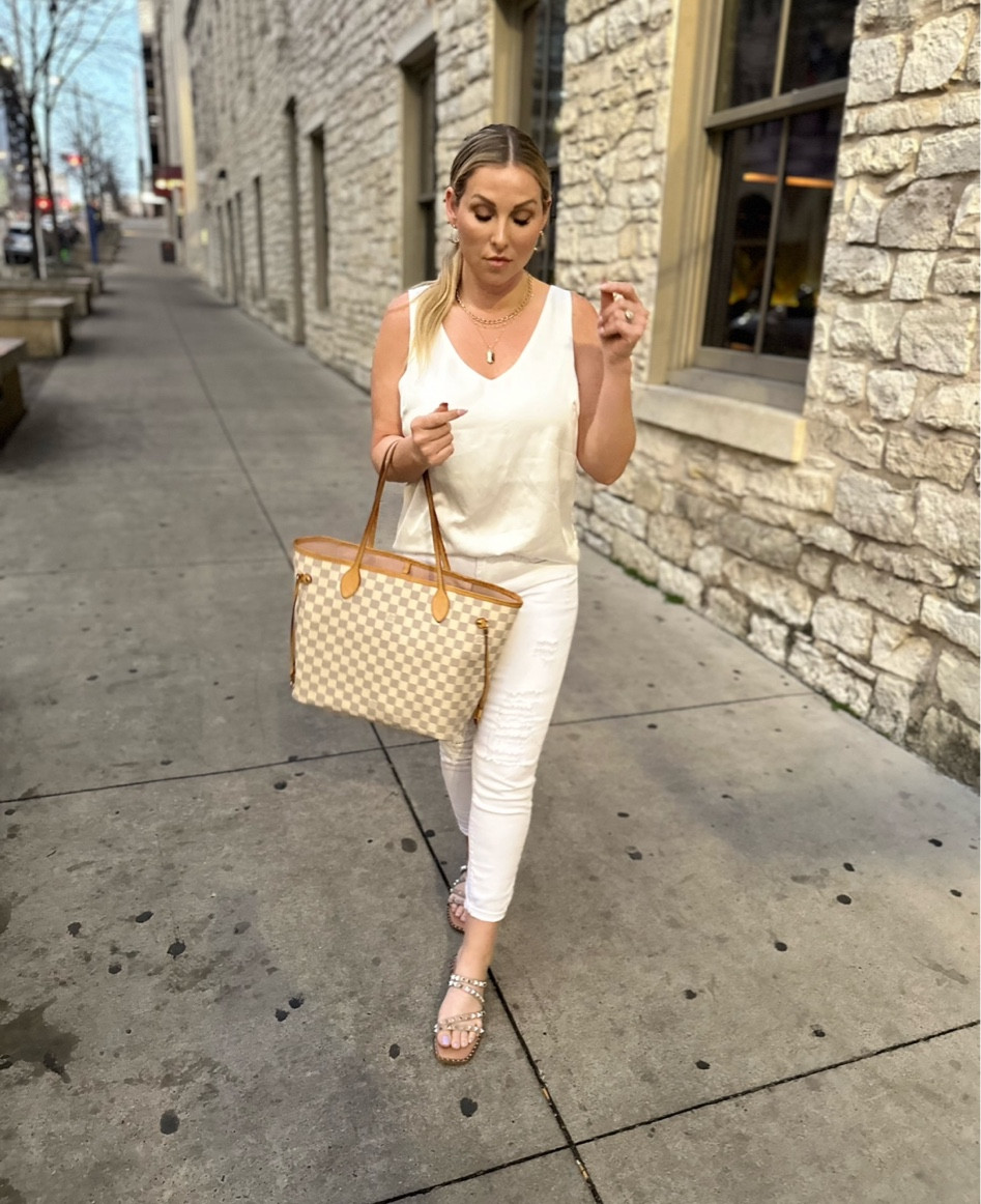 Love a white on white outfit! Wearing a medium on the tank (runs big) and 27 in the jeans! 

#LTKstyletip #LTKSeasonal #LTKFind