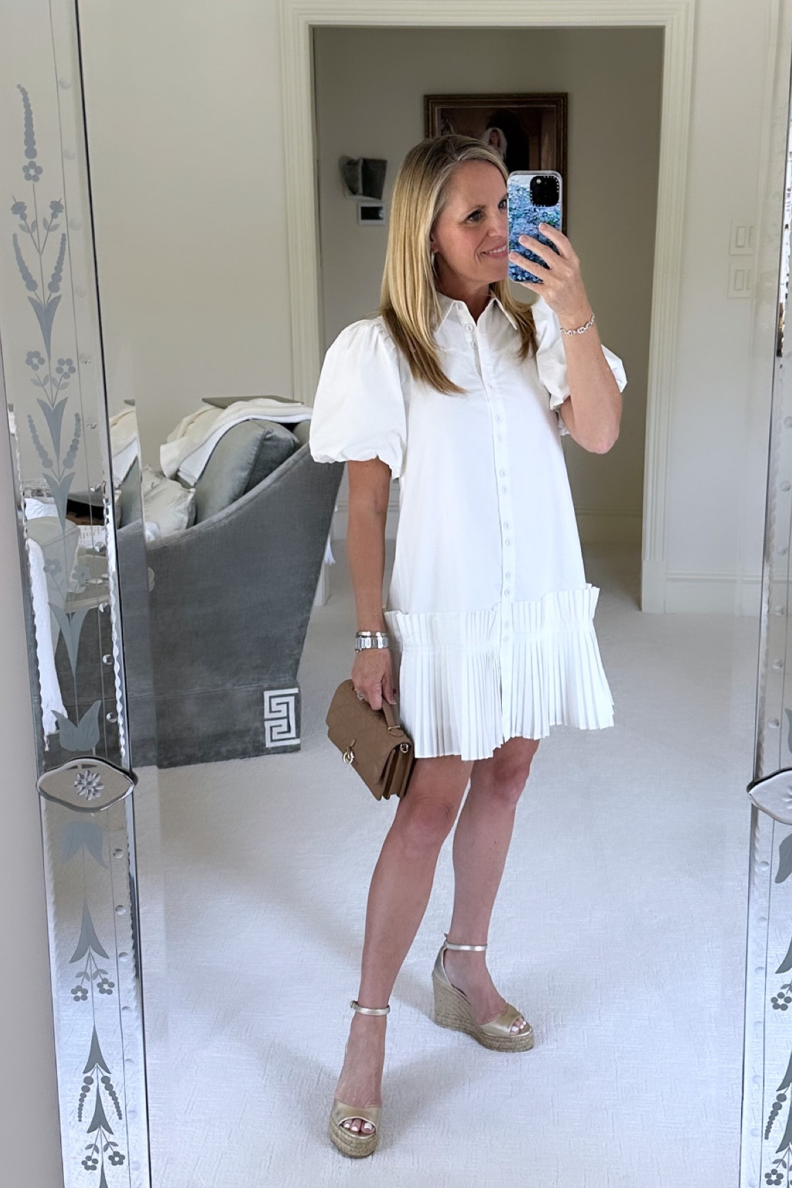 Darling details on this white shirt, dress with puff sleeves and accordion pleat, ruffle, hem line
Fits TTS


#LTKOver40 #LTKFindsUnder100 #LTKSeasonal