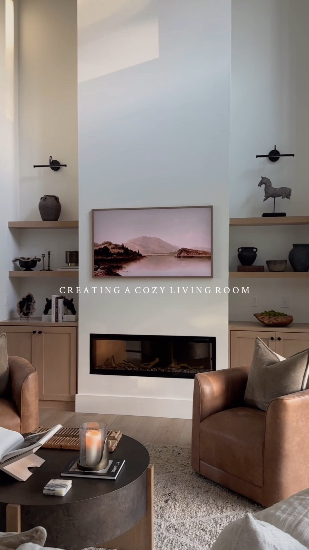 #ad Creating a cozy living room with @Wayfair 🤎

I found the perfect foundation for this space– this beautiful neutral textured wool rug. I’ve layered textures with the metal and wood coffee table, rich brown swivel chairs and velvet throw pillows, and styled organic vases and sculptures on the open shelving. 

#wayfair #wayfairpartner

#LTKHome #LTKSaleAlert #LTKSeasonal