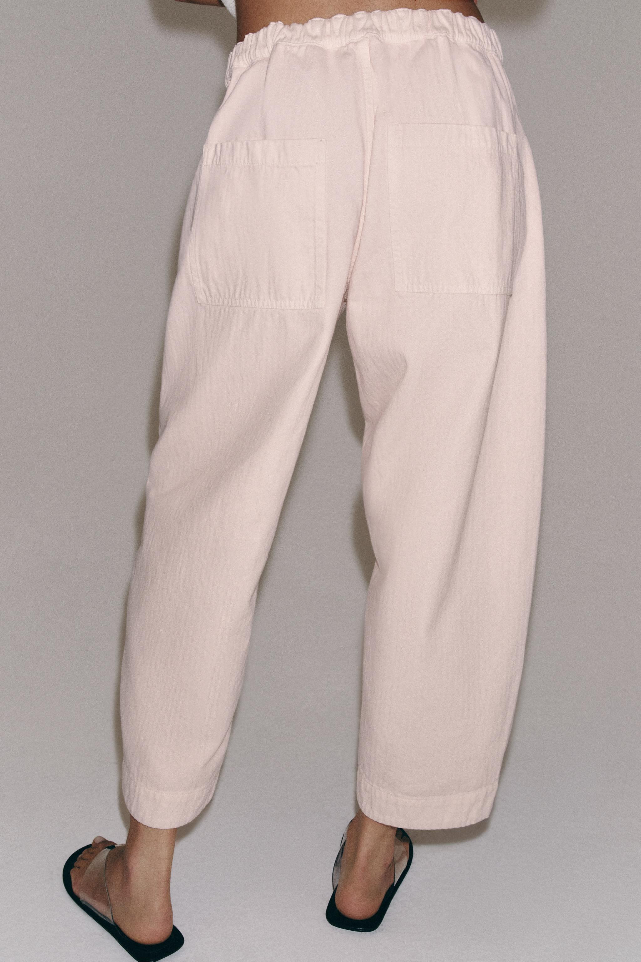 ZARA WOMAN COLLECTIONMid-rise pants made from cotton yarn. Front patch pockets. Wide leg. Front z... | Zara US