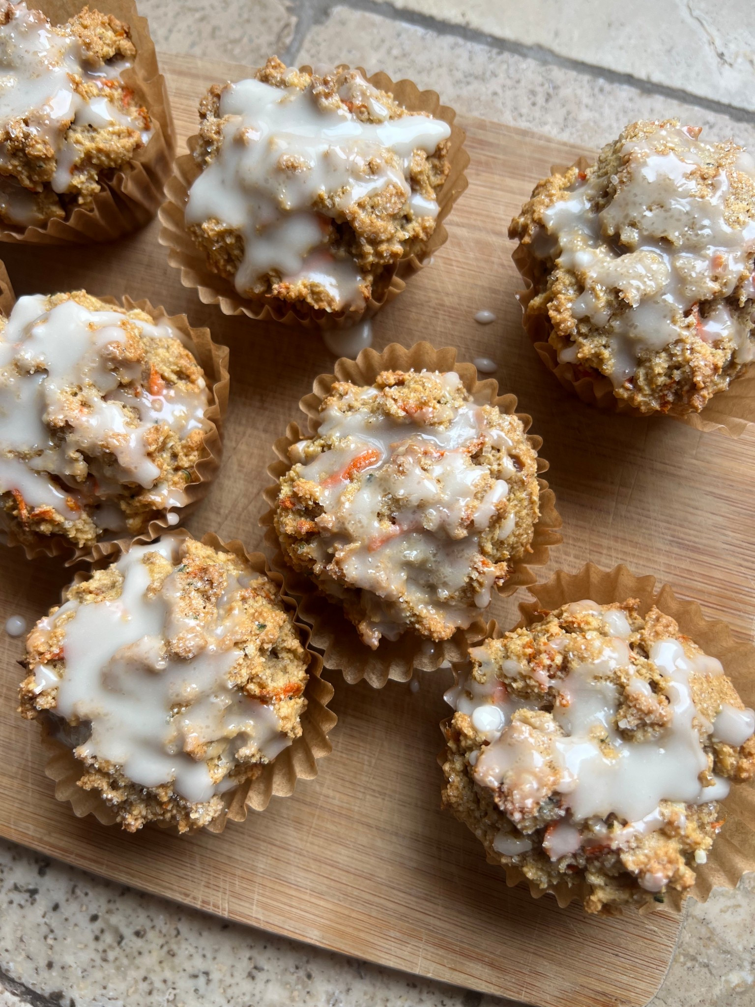 Baked carrot cake muffins in preparation for Easter weekend. They are paleo, so gluten free and dairy free.
Used parchment cupcake liners and cute cutting board for display