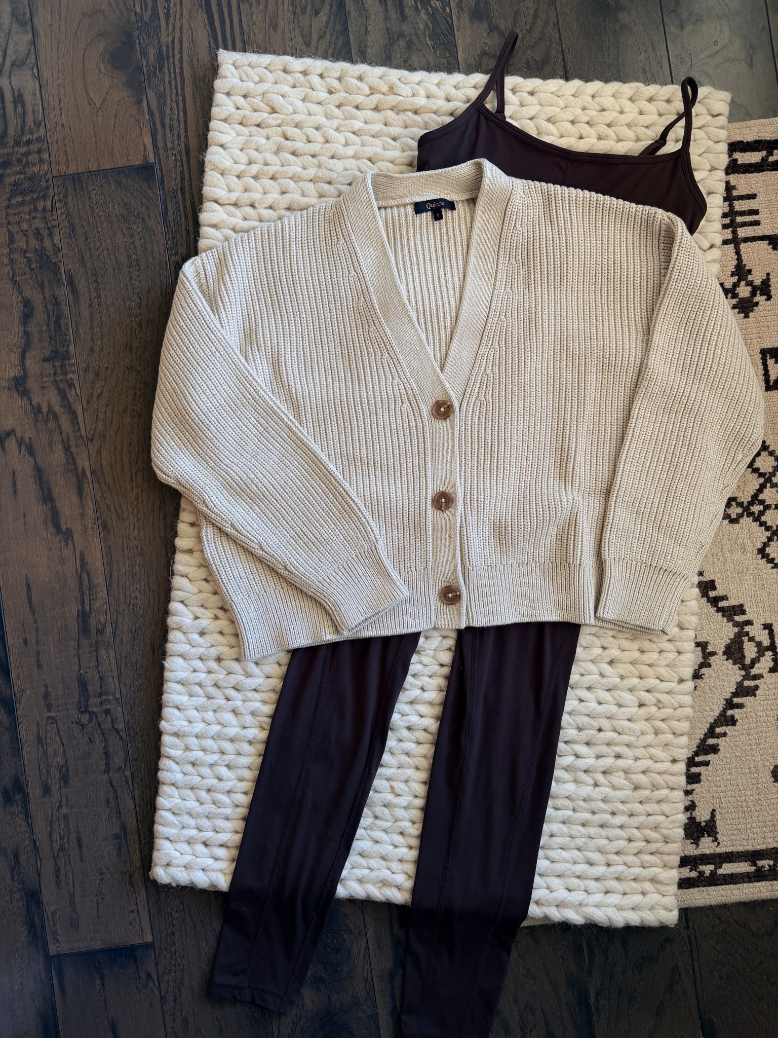 This combo, paired with ballet flats, is doing a lot of heavy lifting in my wardrobe right now. The Quince Organic Cotton Fisherman Boxy Cropped Cardigan in speckled beige layered over the Ultra-Form Jumpsuit in espresso is such a good pairing. The cardigan is chunky & substantial but not heavy, & the boxy fit is so flattering. The jumpsuit underneath does all the work so you look put together without actually trying. Both in a size small & both under $50. This is the kind of outfit I reach for when I need to look intentional but still feel completely comfortable. Quince continues to be one of those brands that just gets it right. Linked in my LTK! @Quince 

quince-quince finds-quince haul-organic cotton cardigan-fisherman cardigan-boxy cardigan-cropped cardigan-speckled beige-ultra form jumpsuit-espresso-quince jumpsuit-quince activewear-jumpsuit outfit-cardigan outfit-layer it up-cozy chic-quiet luxury-elevated basics-affordable fashion-affordable luxury-size small-womens style-mom style-everyday outfit-casual chic-outfit formula-wardrobe staples-fall style-fall fashion-fall outfit ideas-neutral style-neutral outfit

#LTKootd #LTKU #LTKmomlife