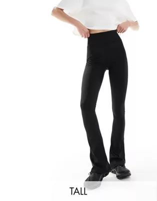 ASOS 4505 Tall - Sportieve kick flare-legging met fijne geribbelde textuur in zwart | ASOS | ASOS (Global)