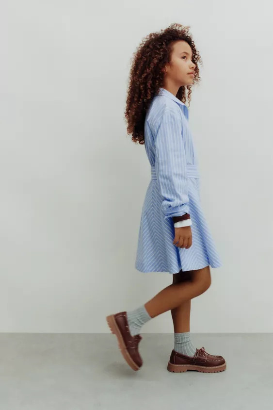 Dress with a shirt collar and long sleeves. Front button closure. Side loops for belt. Striped pr... | Zara US