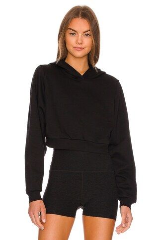 alo Cropped Go Time Padded Hoodie in Black from Revolve.com | Revolve Clothing (Global)