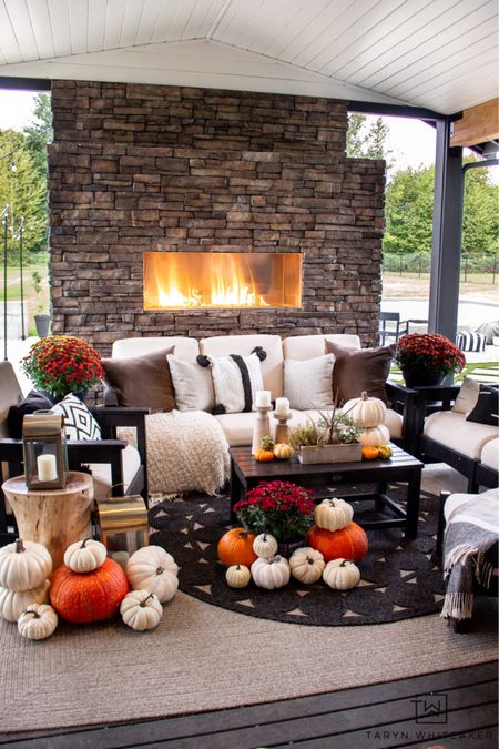 Outdoor living space decorated for fall with pumpkins and mums! 

#LTKHalloween #LTKhome #LTKSeasonal