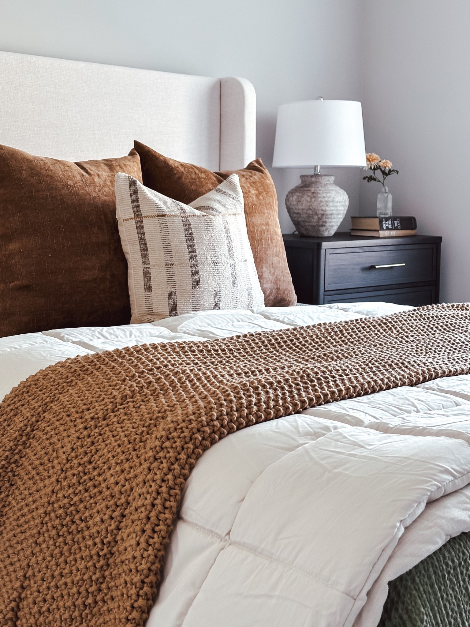 Upholstered headboard, neutral bedroom, black nightstand, neutral table lamp, neutral comforter, green waffle knit blanket, chunky knit blanket, Casaluna bedding sale, neutral bedding, warm brown throw pillows

#LTKSaleAlert #LTKHome