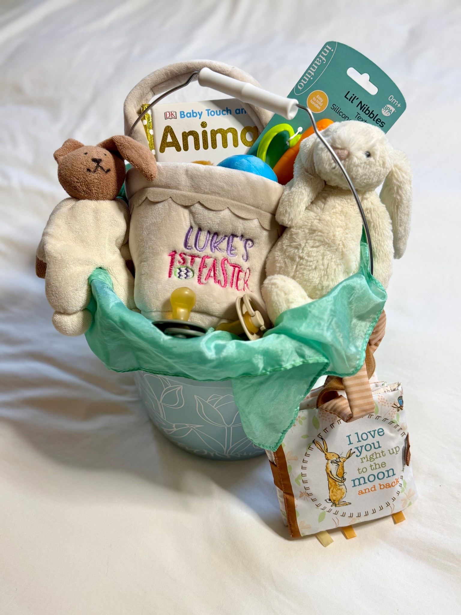Baby’s first Easter basket 🐣🤍

Sharing a simple, baby boy Easter basket idea that’s sweet, practical, and meaningful for year one. His personalized “Luke’s 1st Easter” plush basket is tucked inside a 2-gallon Target Easter bucket (budget-friendly and reusable), layered with a giant Sarah’s Silks playsilk — one of our favorite open-ended toys that grows with them (my 7-year-old still plays with his).

Inside I added an Infantino carrot teether for teething babies, a BIBS natural rubber pacifier (some glow in the dark), a DK Baby Touch & Feel board book, the Guess How Much I Love You soft book for stroller walks and car rides, and a small Bashful Bunny Jellycat — the cutest baby’s first Easter keepsake.

If you’re building a baby Easter basket, newborn Easter basket, or toddler Easter basket, this is such an easy mix of keepsake + practical baby essentials.

Linked this exact baby Easter basket setup plus more Easter basket ideas for babies 👶🏼 

@Target #jellycat 

#LTKBaby #LTKSeasonal #LTKKids
