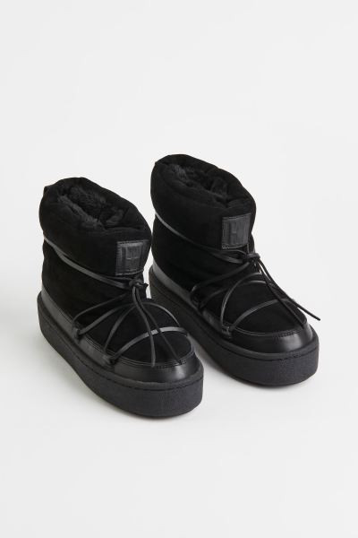 Gewatteerde boots met vetersluiting | H&M (DE, AT, CH, NL, FI)