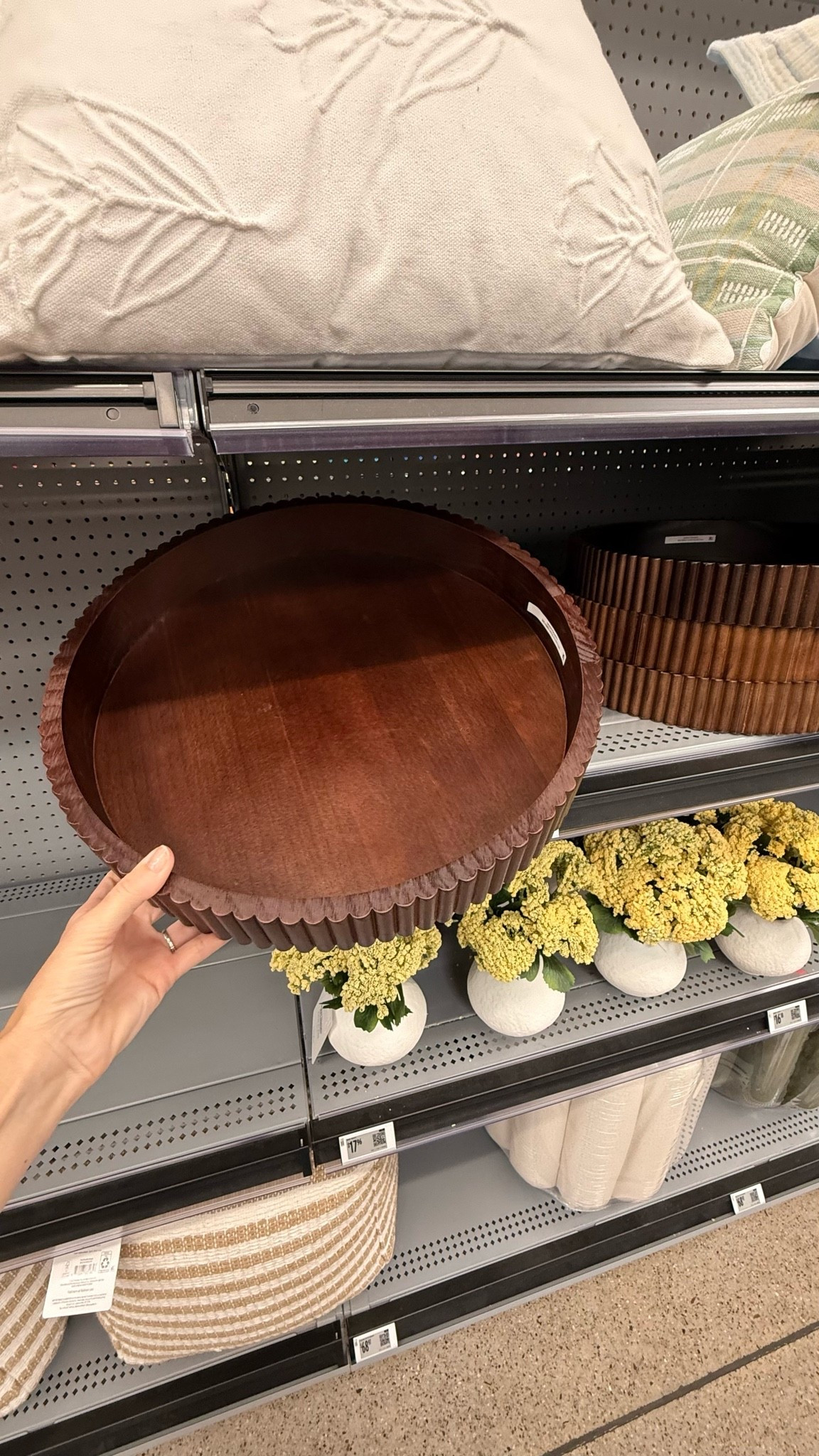 Add warmth and texture to your space with the Better Homes & Gardens Ribbed Wood Decorative Tray, Honey Finish, 16.4" Diameter. Crafted from durable wood with a beautiful honey finish, this round decorative tray features a ribbed design that enhances its natural charm. Perfect for accenting tables, countertops, or shelves, it provides a stylish base for candles, vases, or seasonal décor. The neutral tone complements a variety of home styles, from modern to rustic.
Decorative round wood tray with a ribbed design.

Finished in a warm honey tone for natural appeal.
Perfect for candles, vases, or seasonal décor displays.
Complements Better Homes & Gardens décor collections.

#LTKHome #LTKSeasonal
