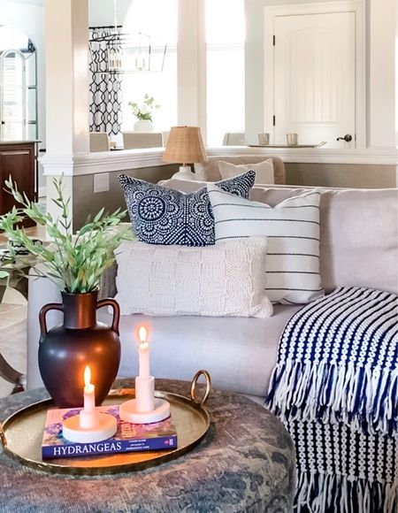 Living room refresh with York sofa, blue and white cozy and comfy throw blanket with fringe and throw pillows, off white throw with black stripe, brass tray, marble candleholders, black vase, greenery, and coffee table books. Home decor accessories, interior styling, design. Pottery Barn, Target, Homegoods, Walmart, Amazon. 

#LTKhome #LTKstyletip #LTKFind