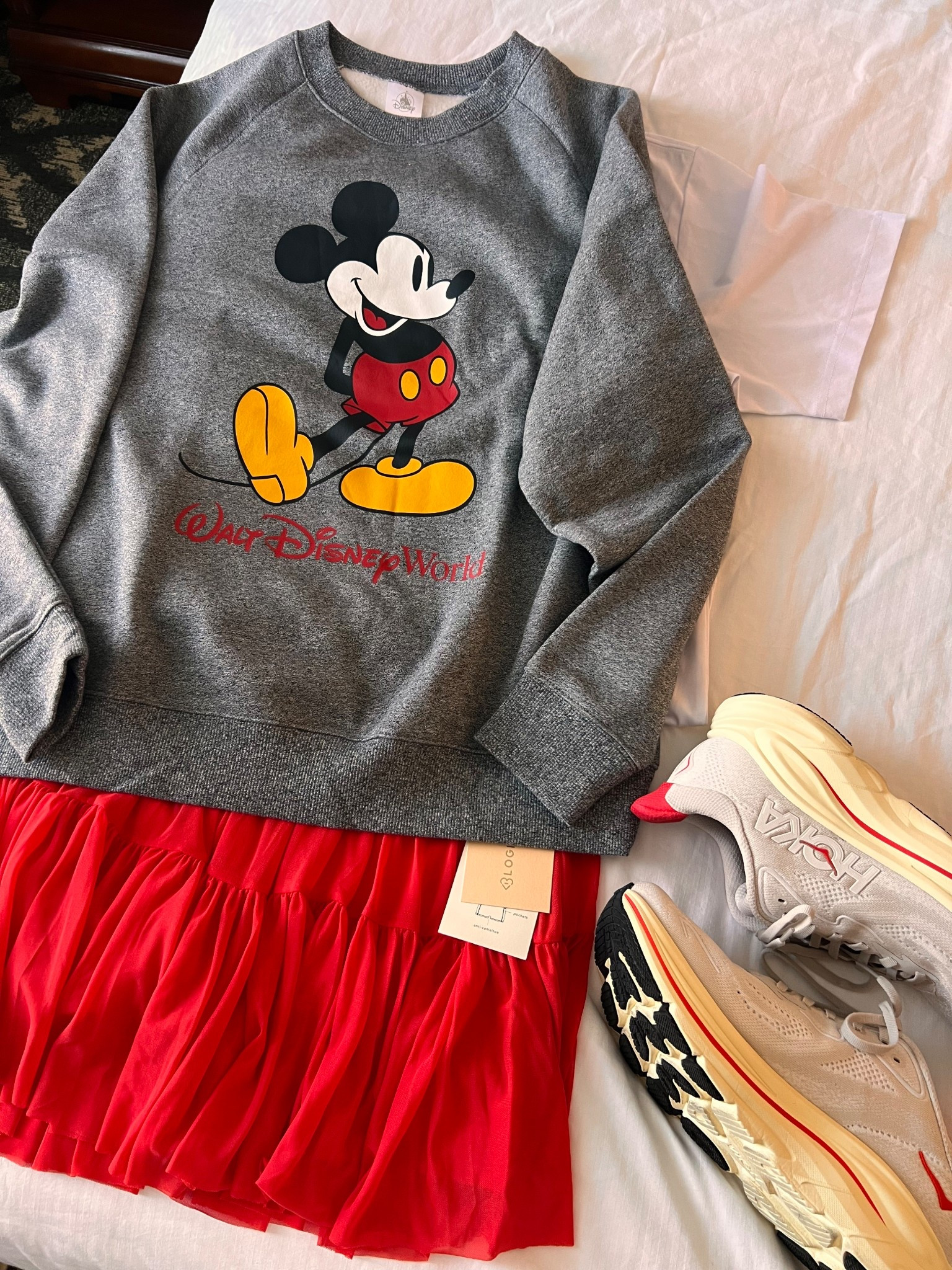 What I wore to Disney to be comfy ALL day! The sweatshirt is from Disney Character Warehouse (outlet), but the skirt & sneakers were ordered before we left. I sized up to a large in the skirt and I’m glad I did. The Hokas run true to size & these ruffle socks are my all time FAV!

#LTKTravel #LTKgrwm #LTKootd