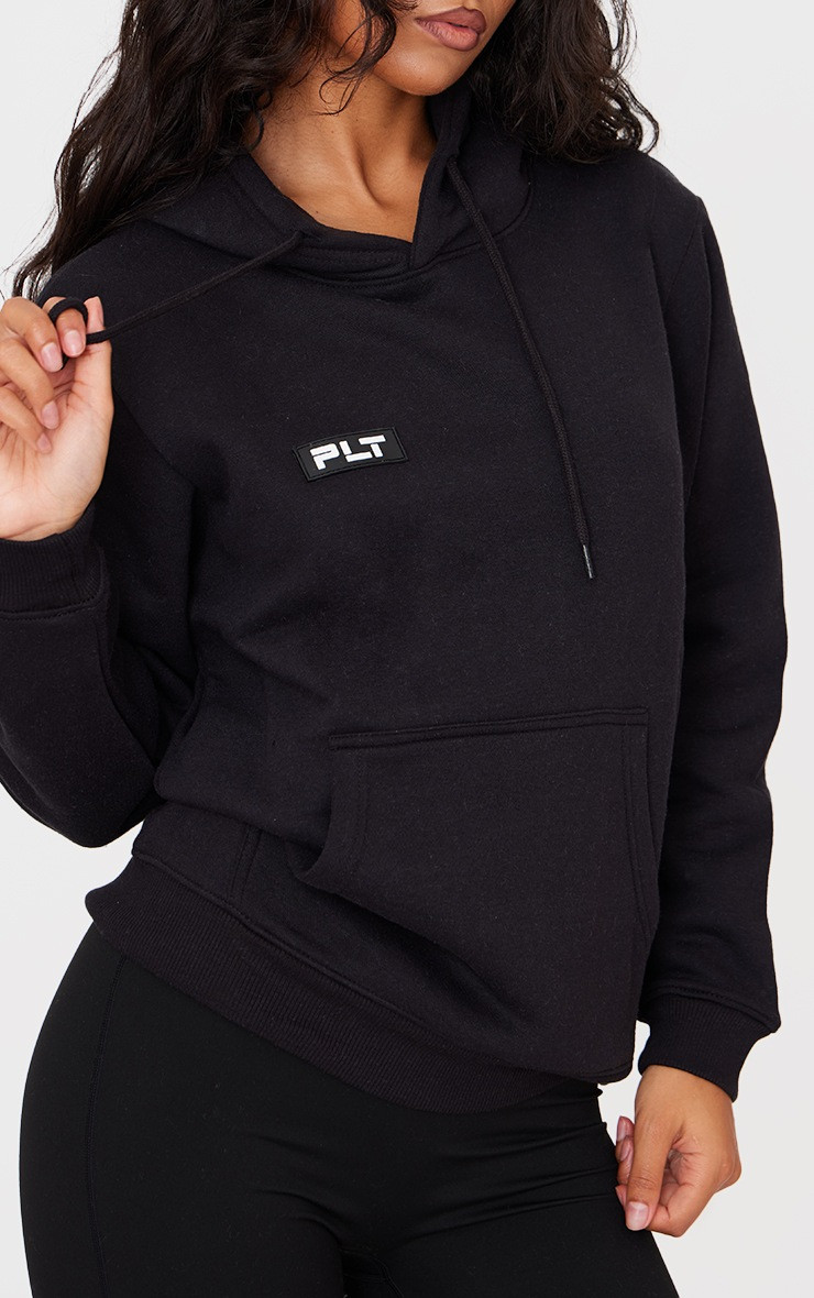 PRETTYLITTLETHING Logo Black Badge Detail Oversized Fit Hoodie | PrettyLittleThing US