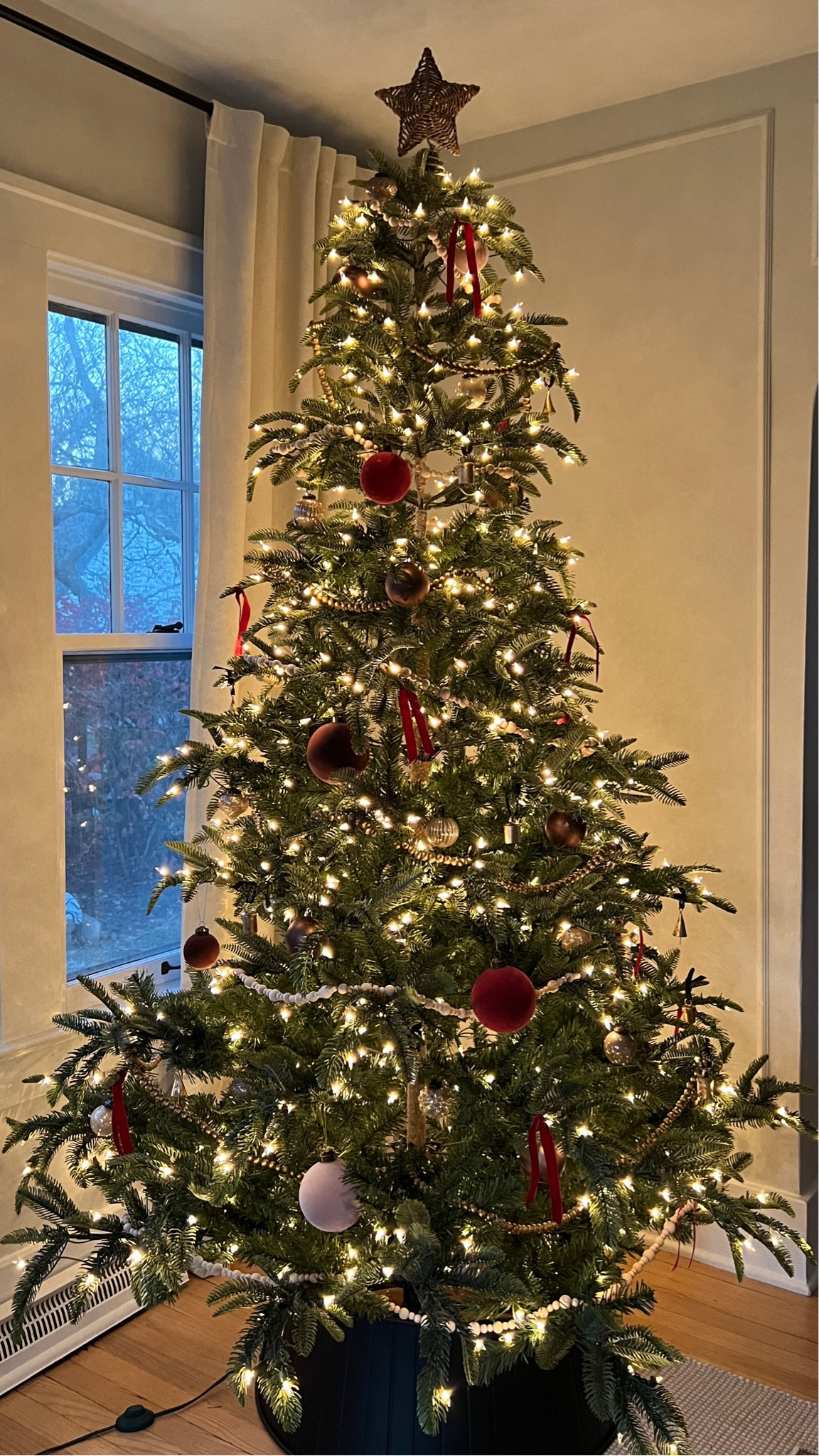Red, burgundy, brown Christmas tree ornaments, bead garlands, brass bells, velvet ribbon, artificial Christmas tree. 

#LTKSeasonal #LTKHoliday #LTKCyberweek