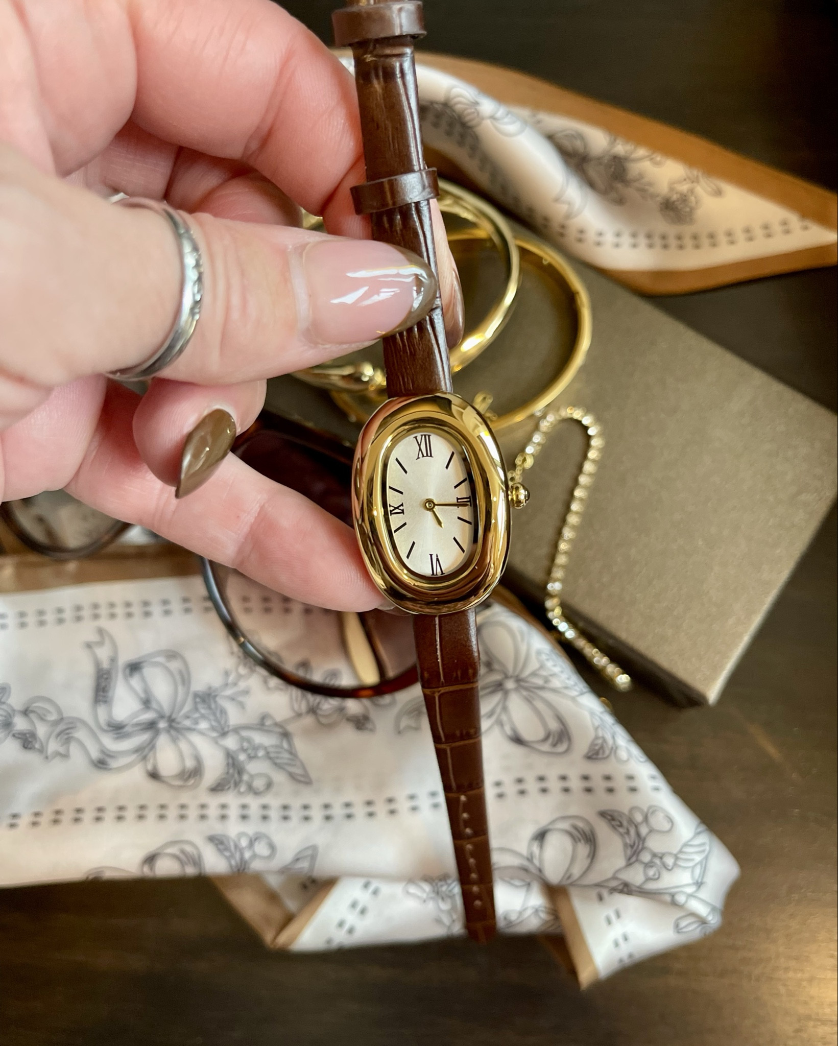 Looking for an affordable watch that looks high end? This is it! So beautiful in person! I’ve added it with gold bracelets. 
Accessories are always a great gift idea for her!

@amazonfashion affordable accessories, gift guide for her. gold watch, gold bracelets bangles, neck scarf, sunglasses 

#LTKOver40 #LTKGiftGuide #LTKHoliday