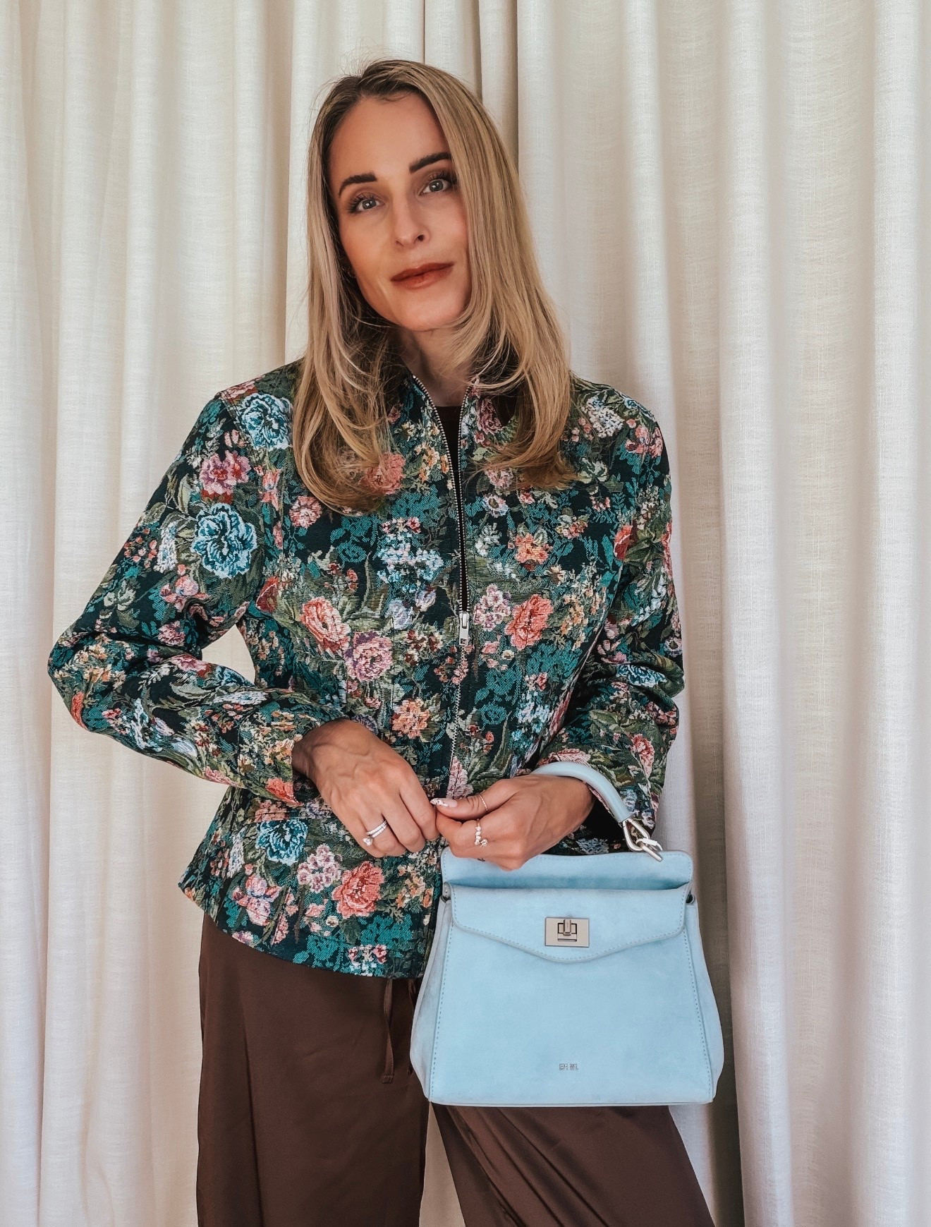 Fall jacket in floral and a blue suede bag

#LTKSeasonal