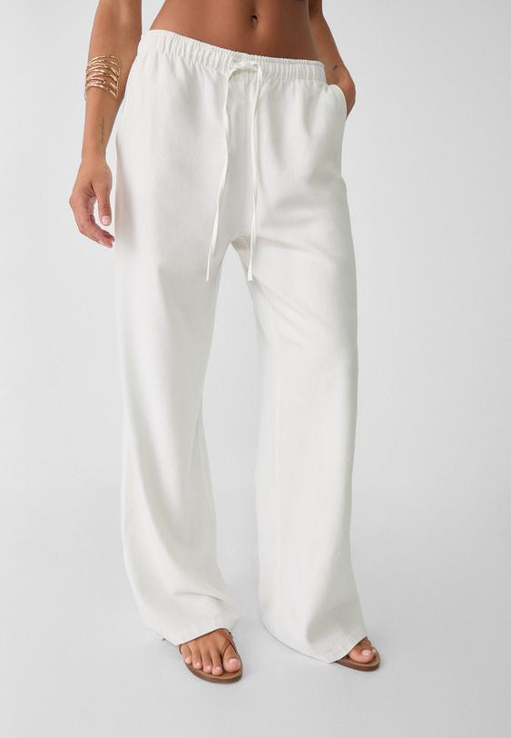 Loose-fitting linen blend trousers - Women's Trousers | Stradivarius United Kingdom | Stradivarius (UK)