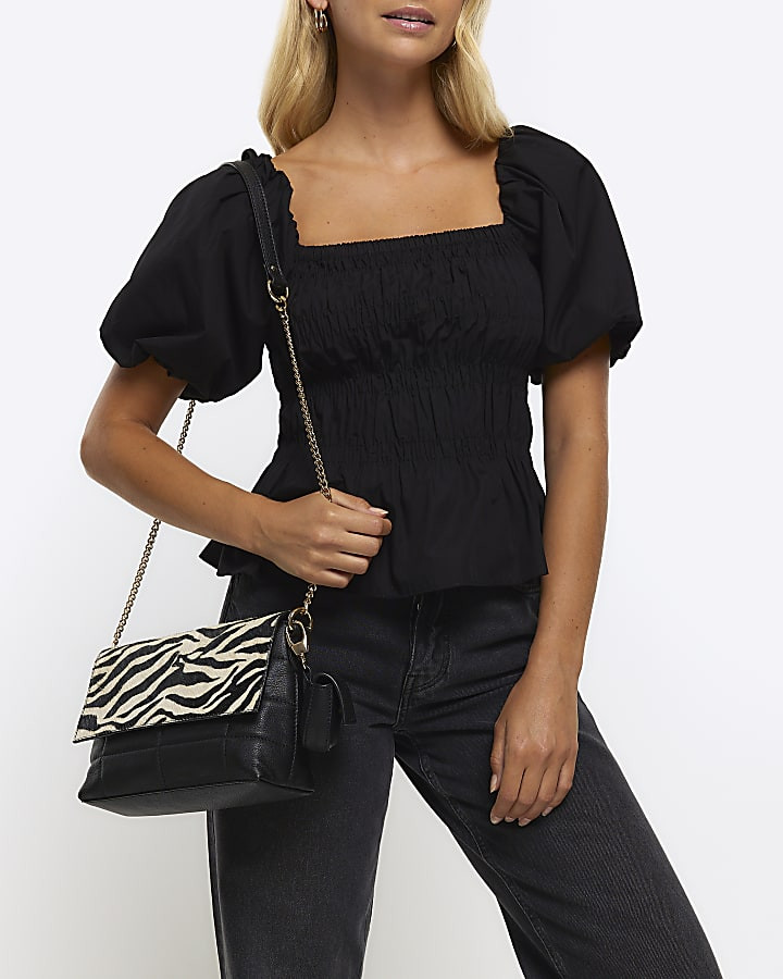 Black leather zebra print cross body bag | River Island (UK & IE)