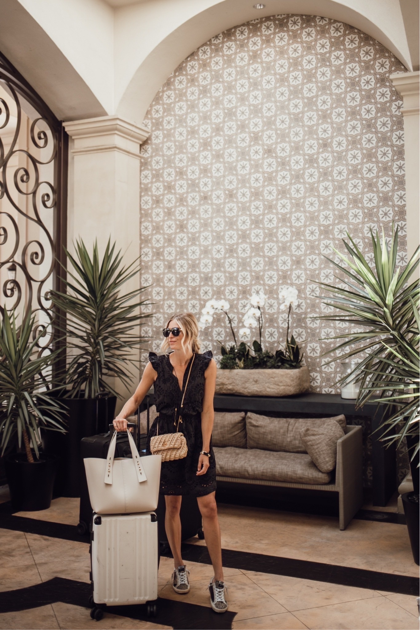 Easy travel look🤍 Similar black dress, similar sneakers, straw bag, similar tote and suitcase. 

#LTKtravel #LTKSeasonal #LTKFind