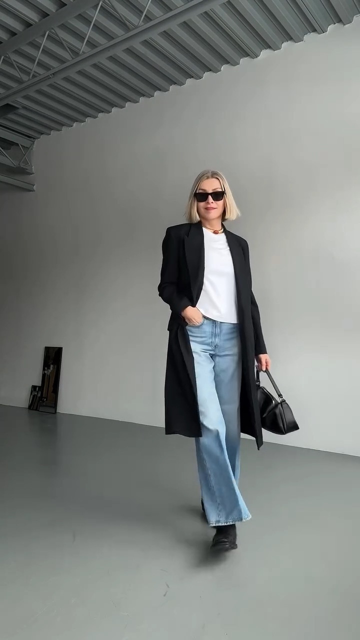 I'm particular about hemlines. Usually I go longer, longer, longer... but that length needs a heel. With these western style boots and flare jeans, the proportion shifts. The hem hits just above the boot so you actually see it. Shorter than my usual, but it works for this silhouette.

Proportion can break or make the outfit. This is the proportion that works here.
Everything else is minimal. White tee, structured blazer, one gold necklace with a touch of red. That necklace is the only punctuation. 

And the bag...my favorite slouchy of the moment - small by design, big on purpose @poelle_atelier 👌🏽

Links to the pieces coming in stories.

#bottegaveneta #westernboots #acnestudiosjeans #over50 #gift