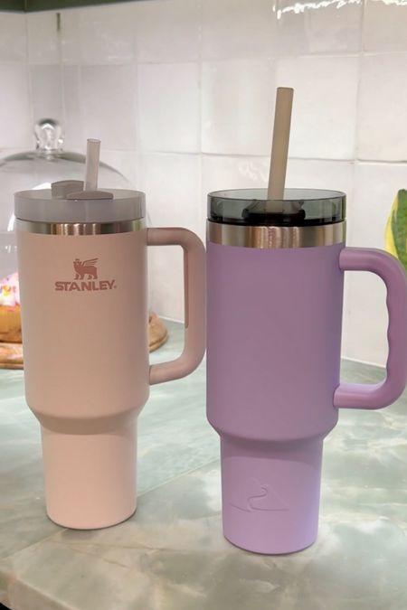 Stanley versus Ozark Trail! They are both 40oz tumblers with similar features but the Ozark Trail is over 50% less than the Stanley! 🤑 I’m
going with Ozark Trail (which is the purple one in the pic). 

#LTKfindsunder100 #LTKfindsunder50 #LTKhome