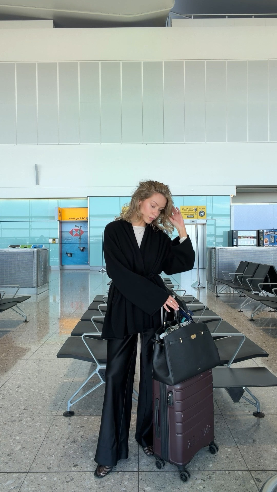 Airport outfit idea - silk trousers, knit cardigan, demellier bag, antler suitcase

#LTKuk #LTKspring #LTKtravel