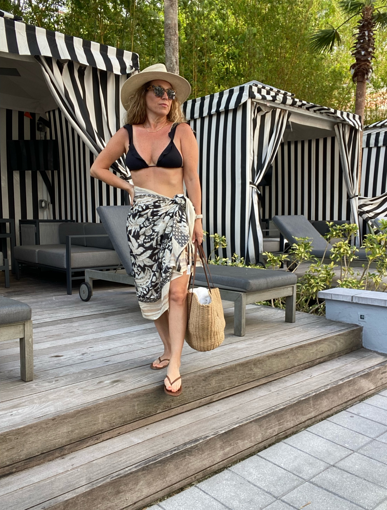 Beach look!  Simple black bikini with a sarong, hat and bag!  Similar looks linked below!

Black bikini, printed sarong, coverup, black swimsuit, straw hat, straw bag, sandals, brown flip flops

#LTKtravel #LTKover40 #LTKswim